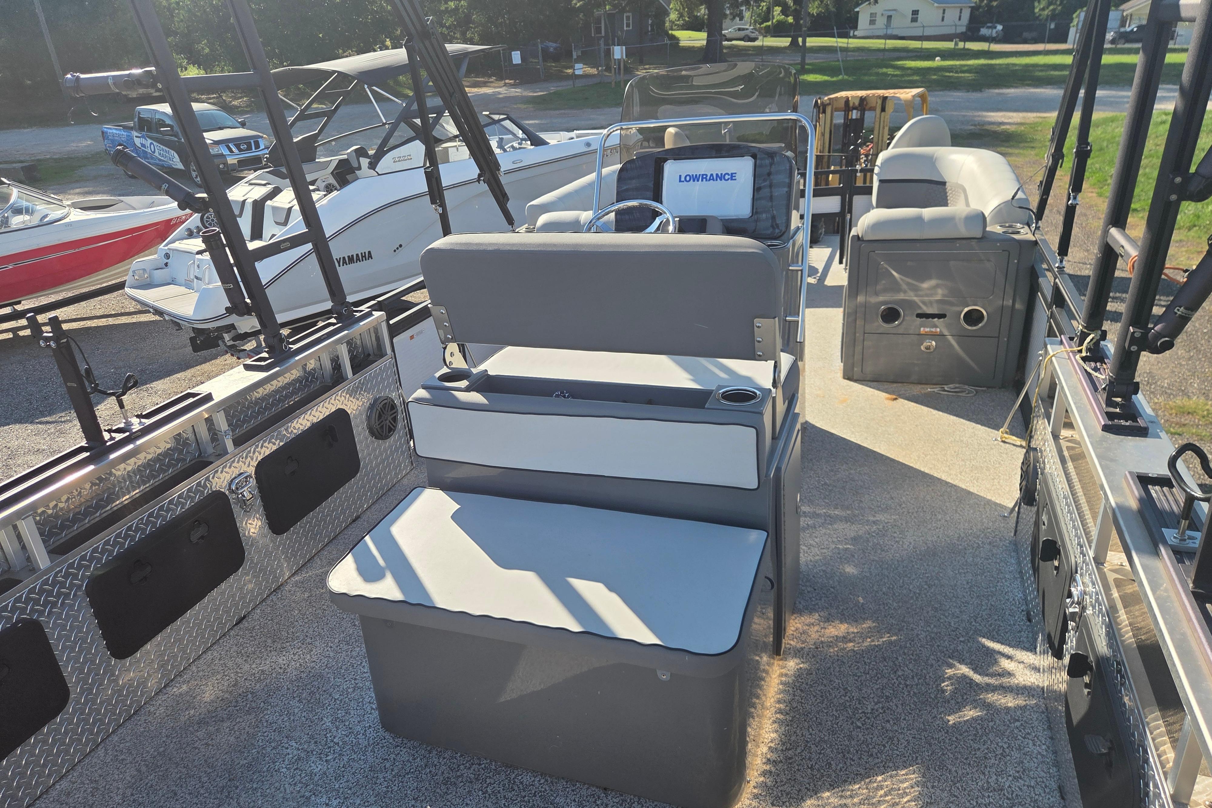 2024 Angler Qwest 8526 Pro Troll boat interior with seating and fishing equipment.