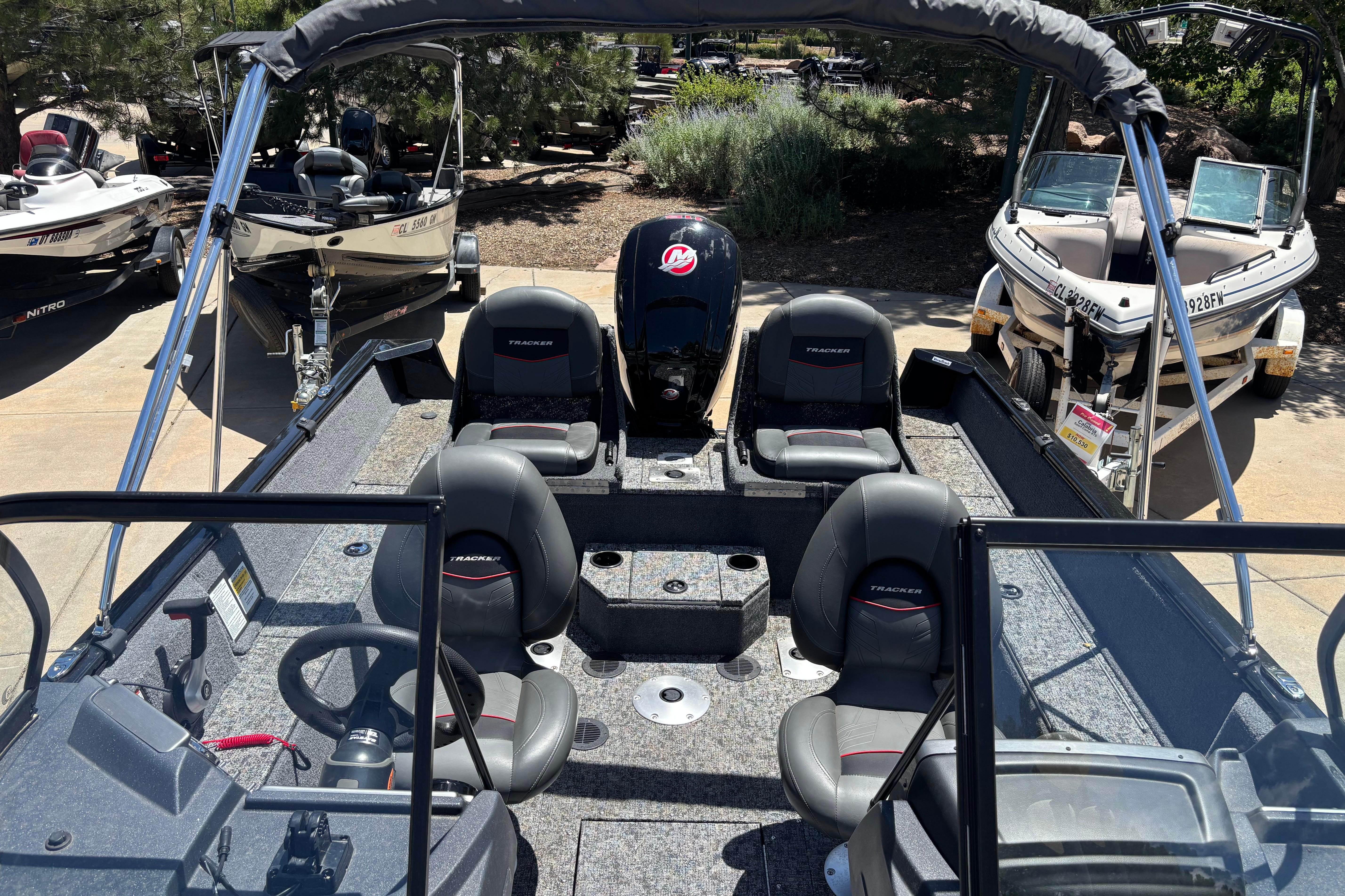 2025 Tracker Pro Guide V-175 Combo boat interior with seating and steering wheel.