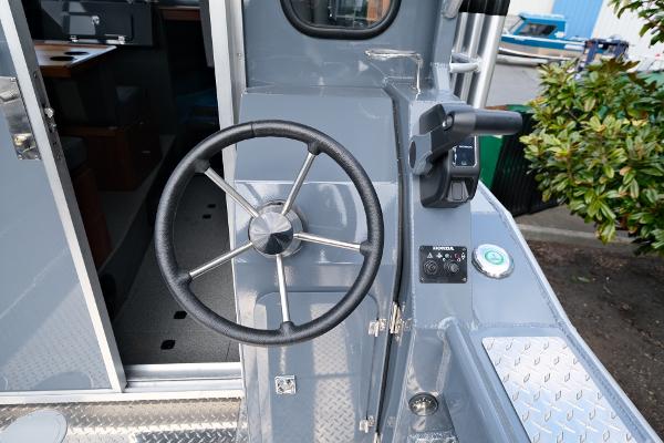 2024 Hewescraft 250 Explorer steering wheel and controls, showcasing modern design and functionality.