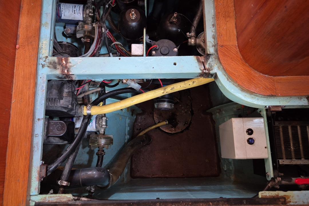 1953 Beister Super 1500 engine compartment with visible wiring and components.