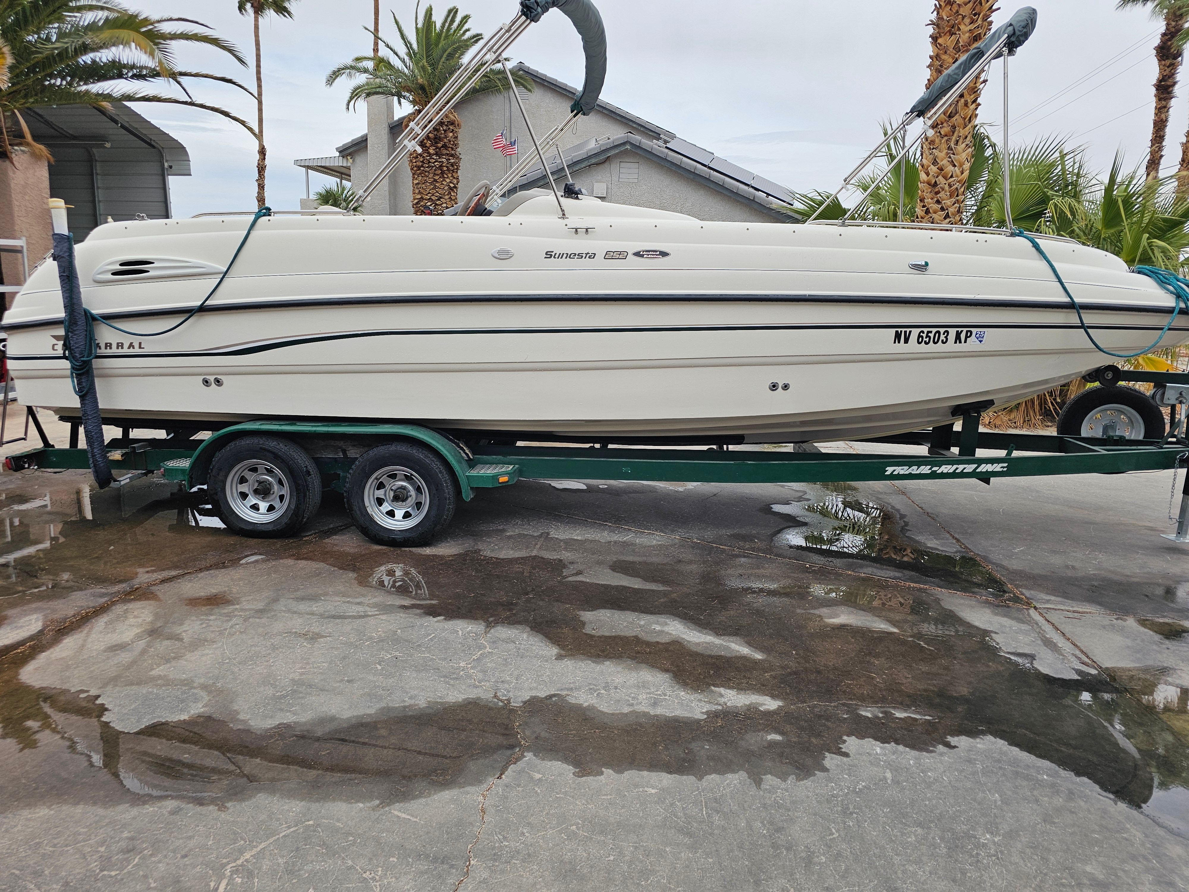 1998 Chaparral Sunesta 252 Special Edition on trailer, side view.