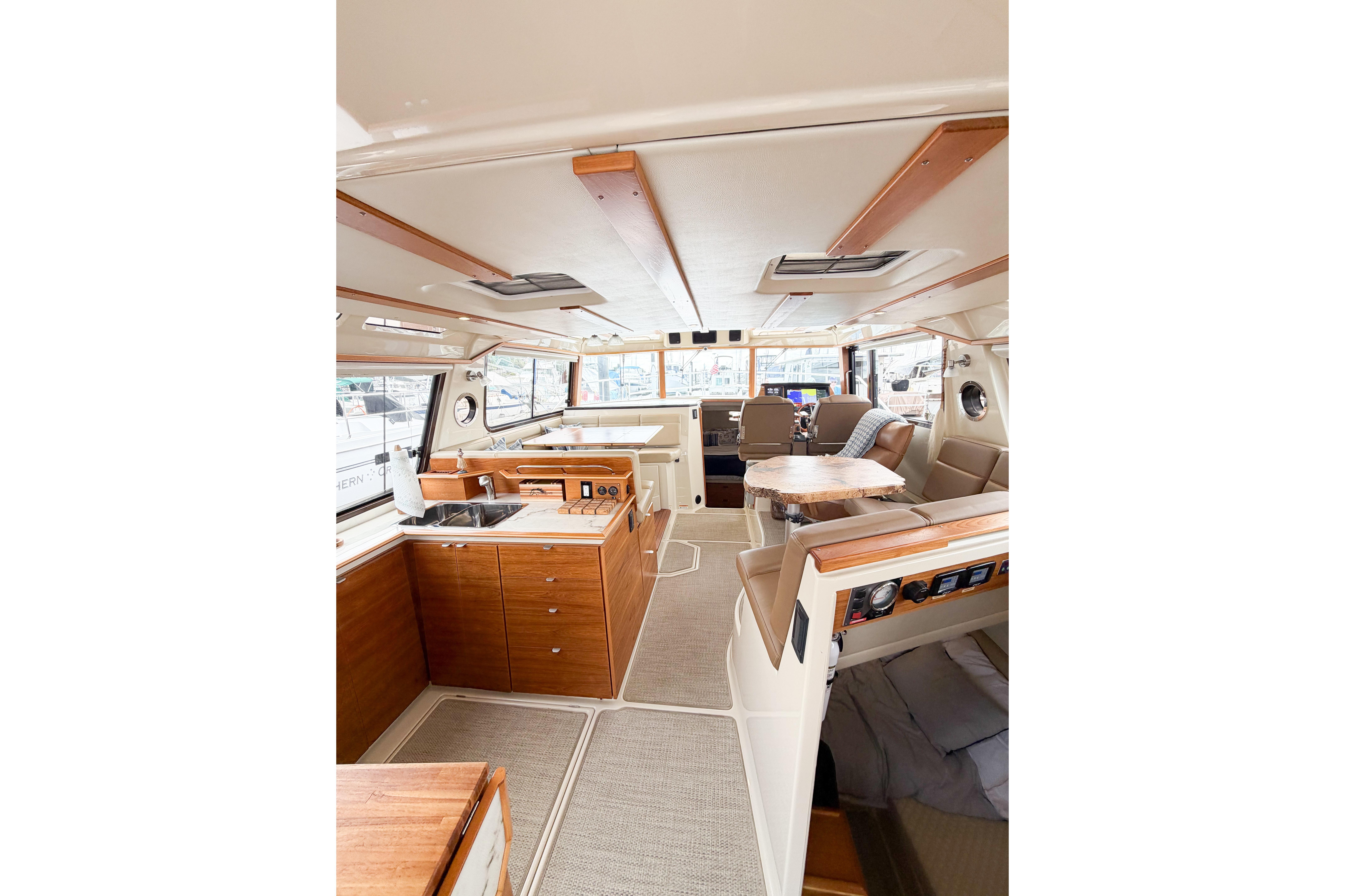 Interior of 2022 Ranger Tugs R-43 CB, featuring modern kitchen and seating area.