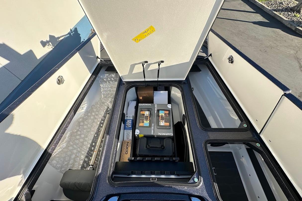 2026 Ranger Z521R boat storage compartment with Garmin equipment and accessories.