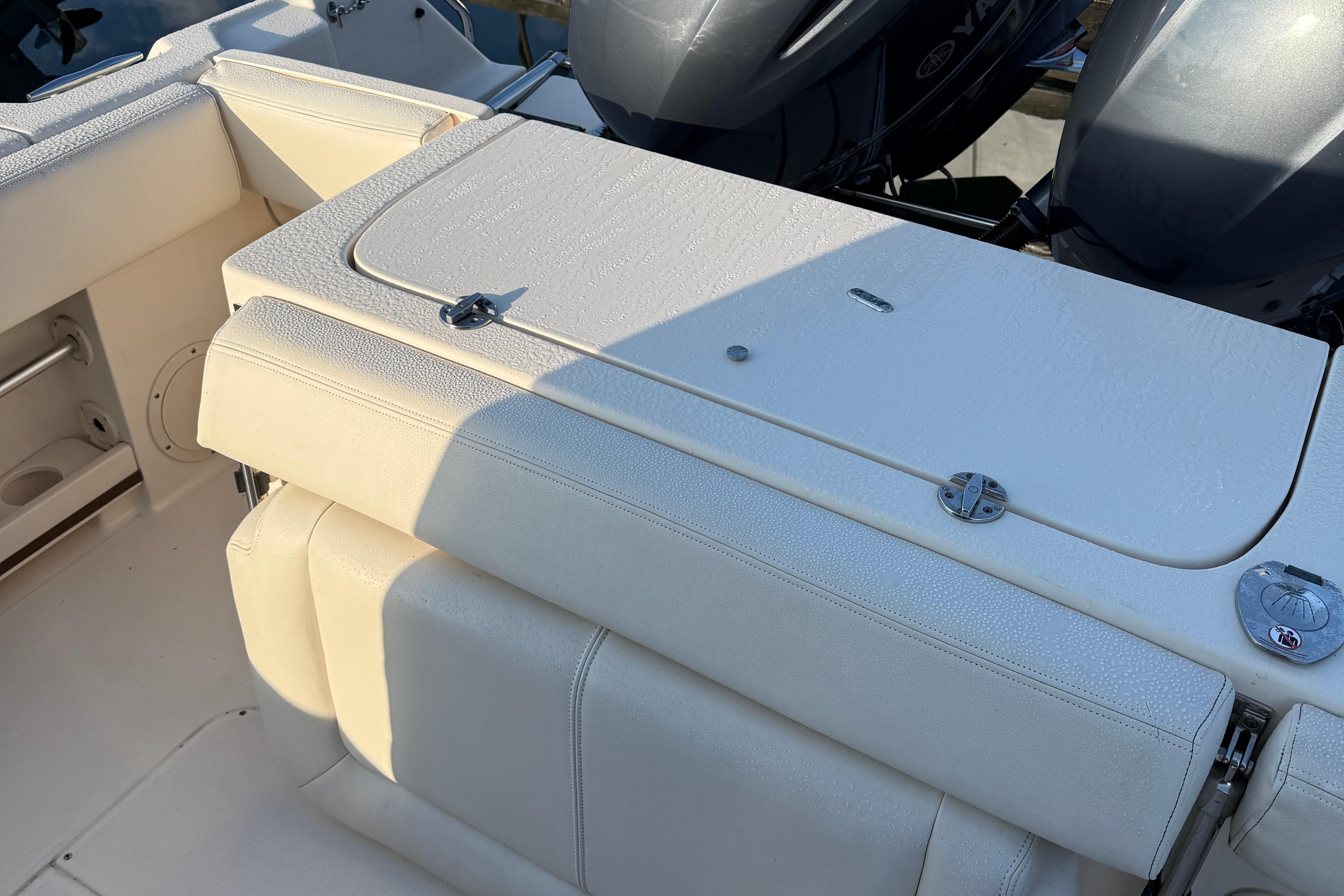 2017 Grady White 257 Fisherman boat interior with seating and engine view.