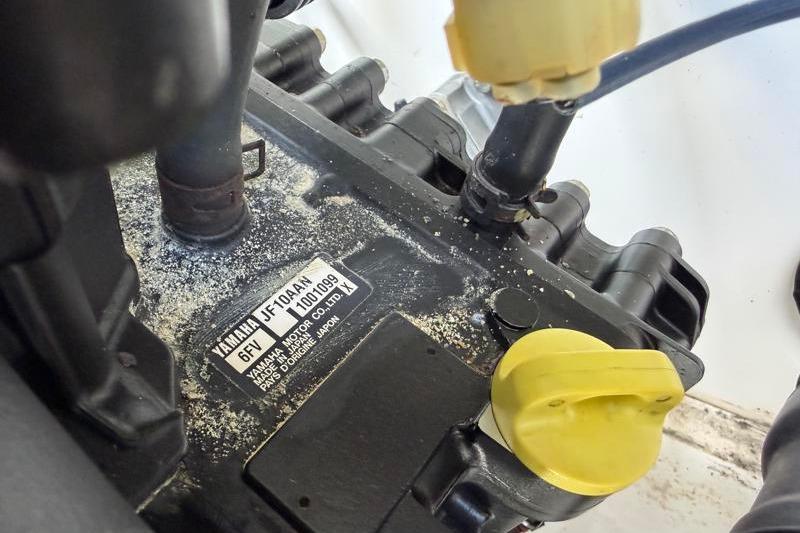 Close-up of a 2017 Yamaha SX210 engine component with visible labels and connectors.
