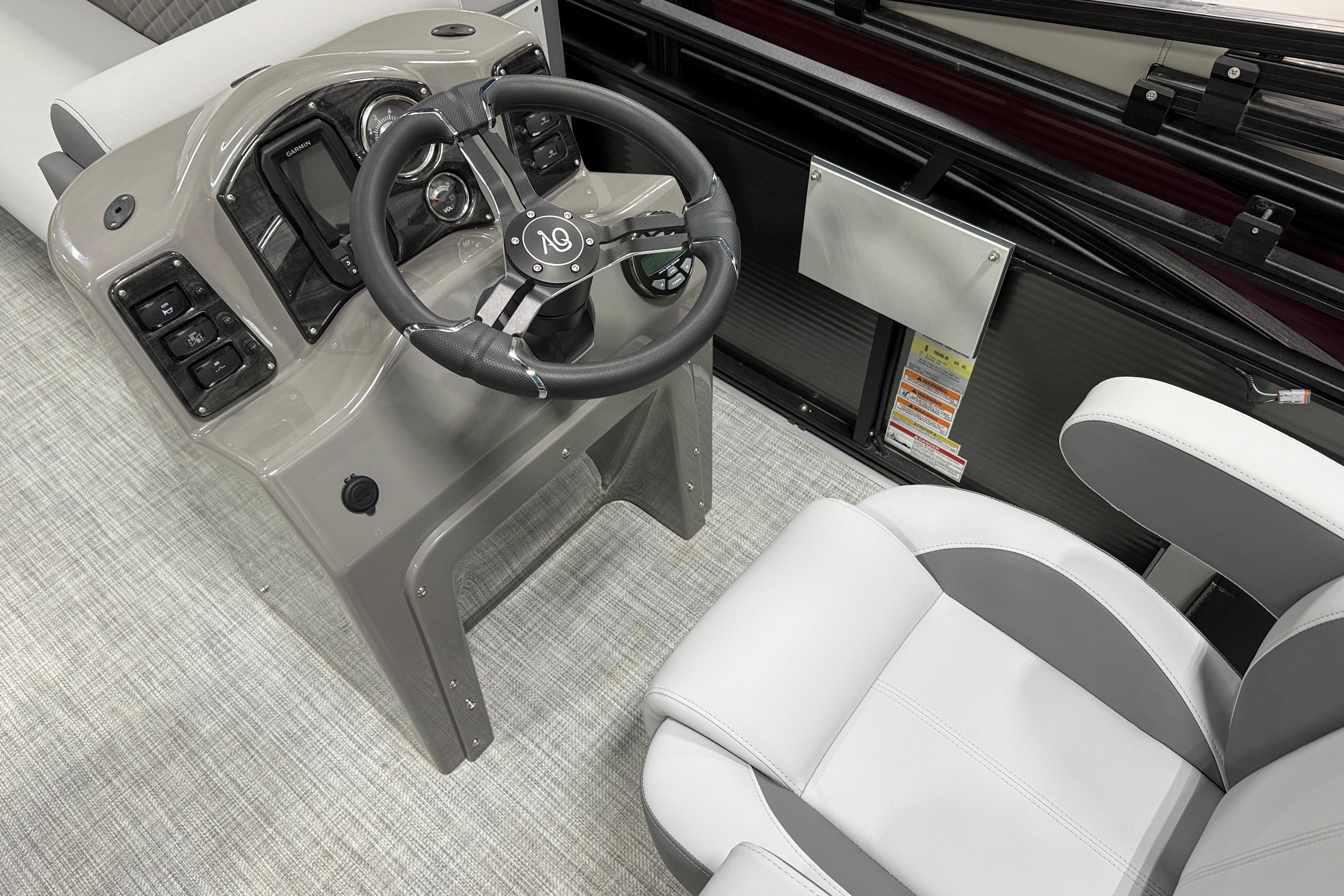 2026 Angler Quest 818 Panfish Cruise boat interior with steering wheel and seating.