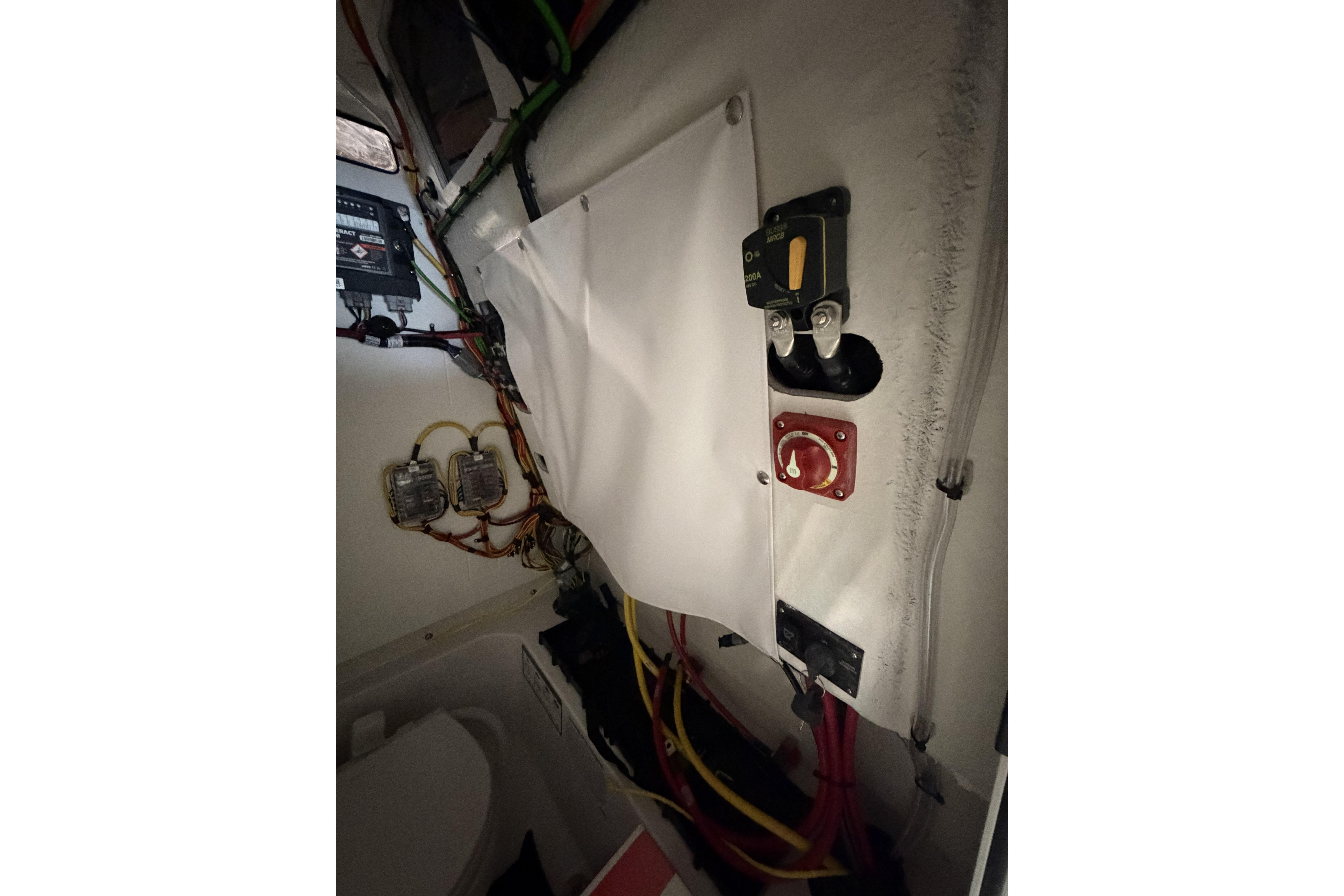 Interior wiring and controls of a 2026 Sportsman Open 232 Center Console boat.