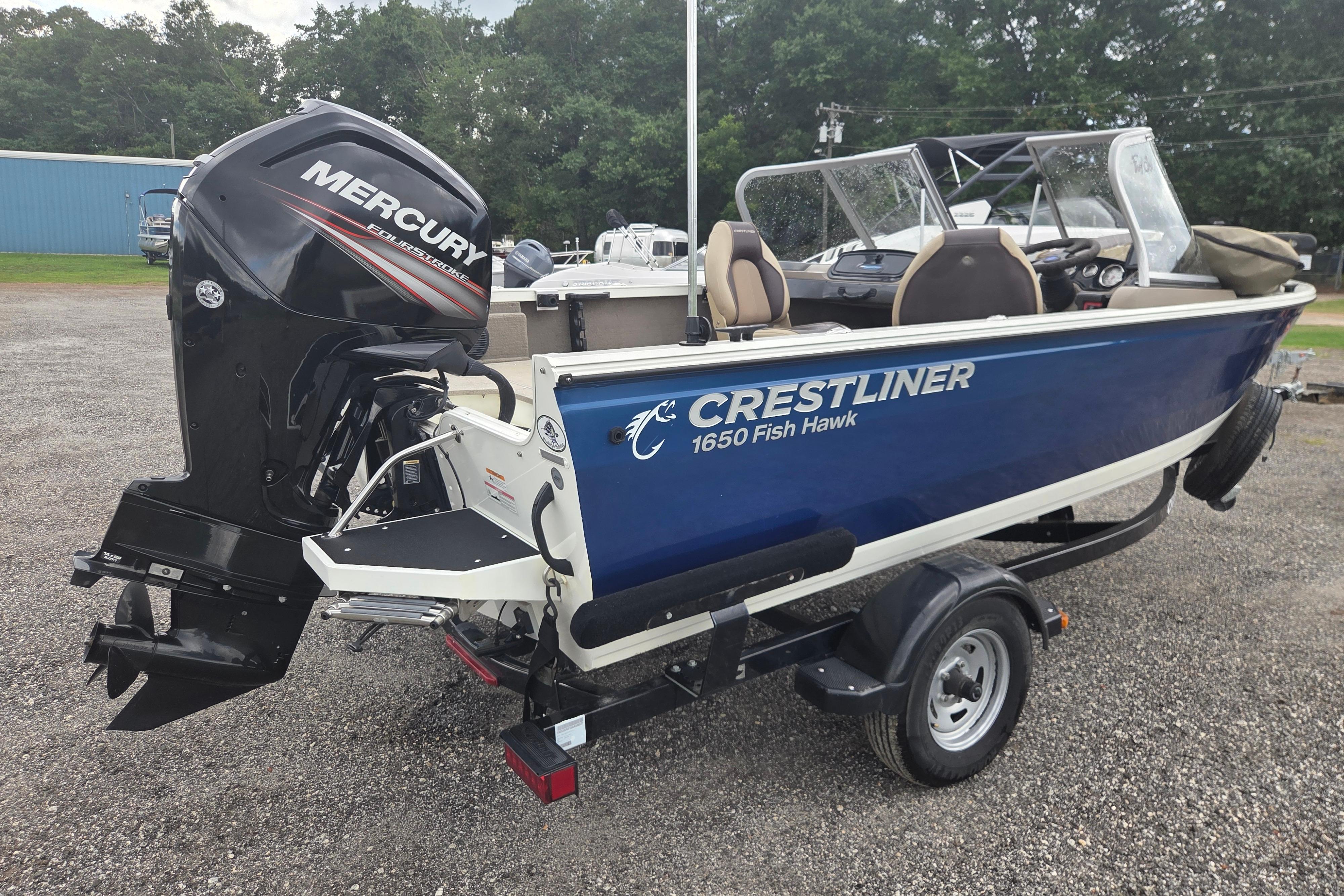 2016 Crestliner 1650 Fish Hawk SC boat with Mercury outboard motor on trailer.