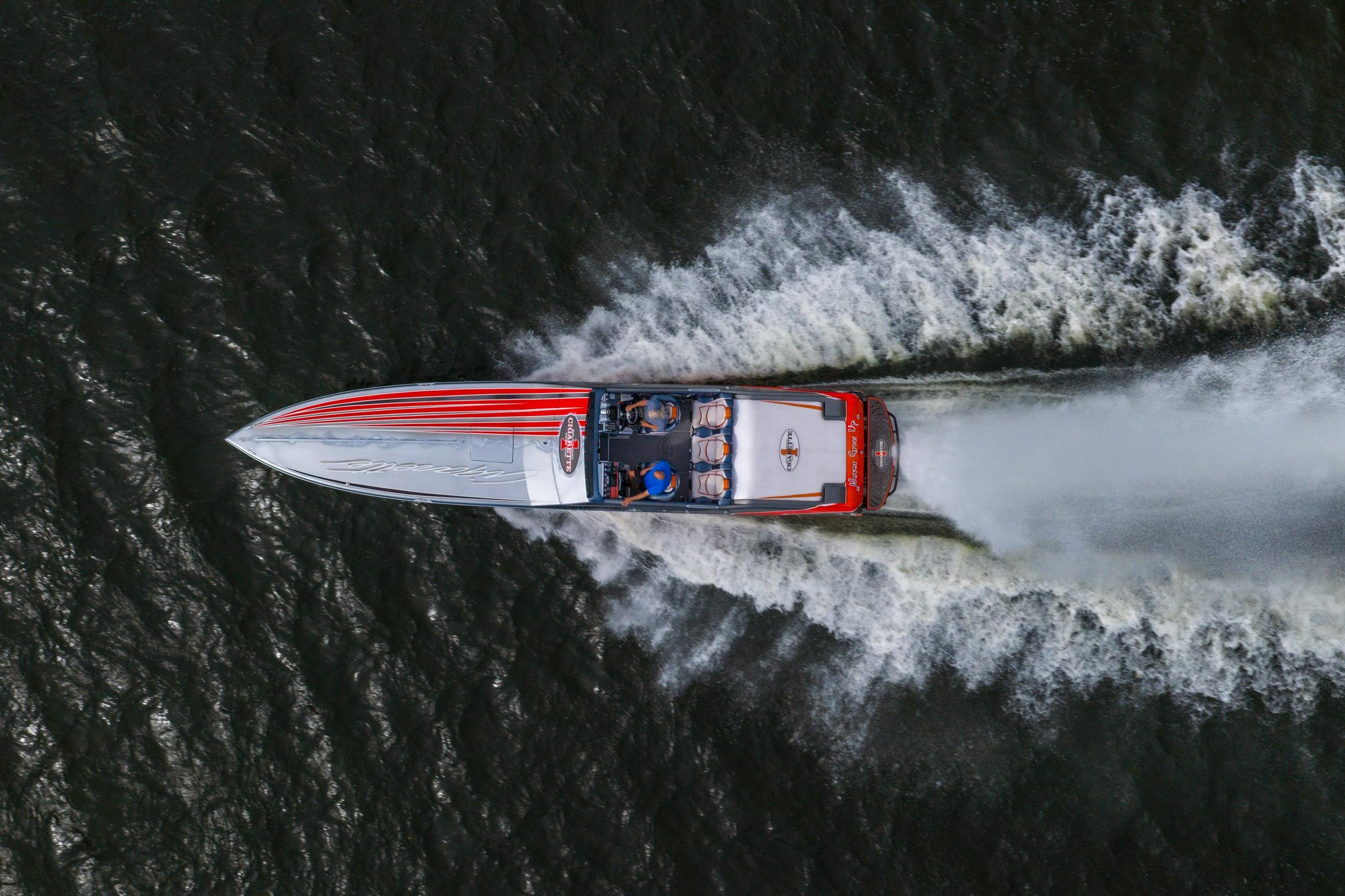 Aerial view of a 2006 Cigarette 39' Top Gun speedboat racing on water.