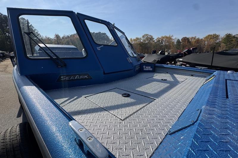 2026 SeaArk Dynasty 2.0 boat with blue exterior and spacious deck in outdoor setting.