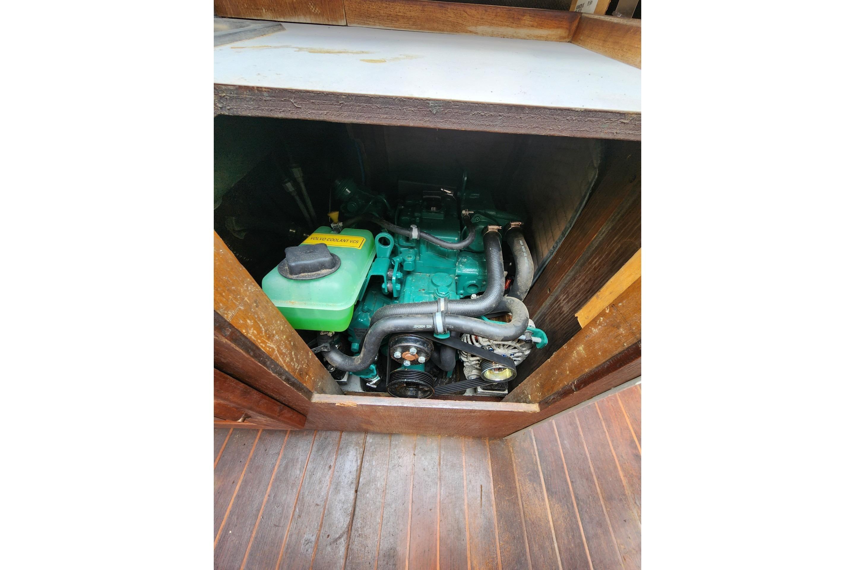 Engine compartment of a 1988 O'Day 272 LE sailboat, showcasing mechanical components.