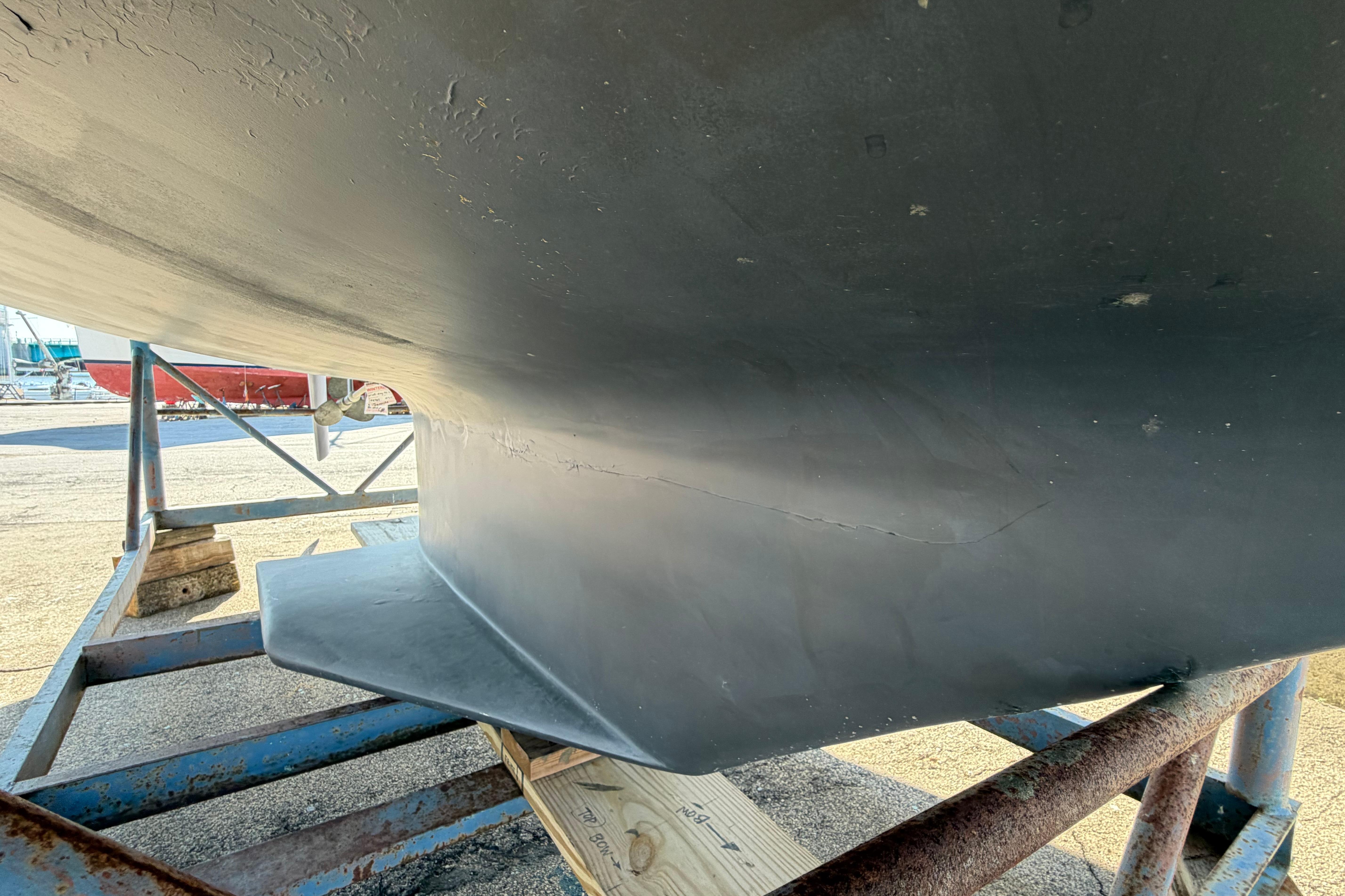 Bottom view of a 1988 Catalina 30 MkII sailboat hull on a stand.