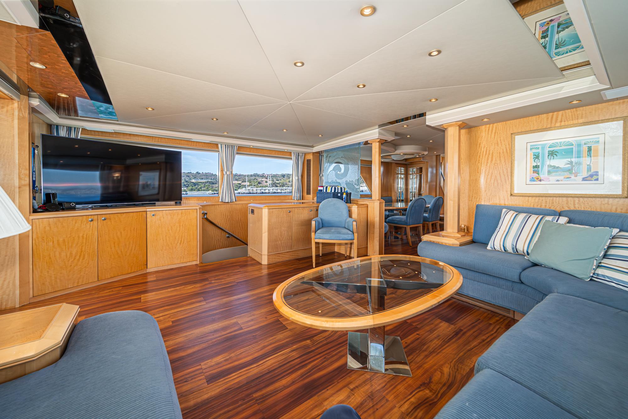 Luxurious 1995 Nordlund Cockpit Motor Yacht interior with elegant wood finishes and modern furnishings.