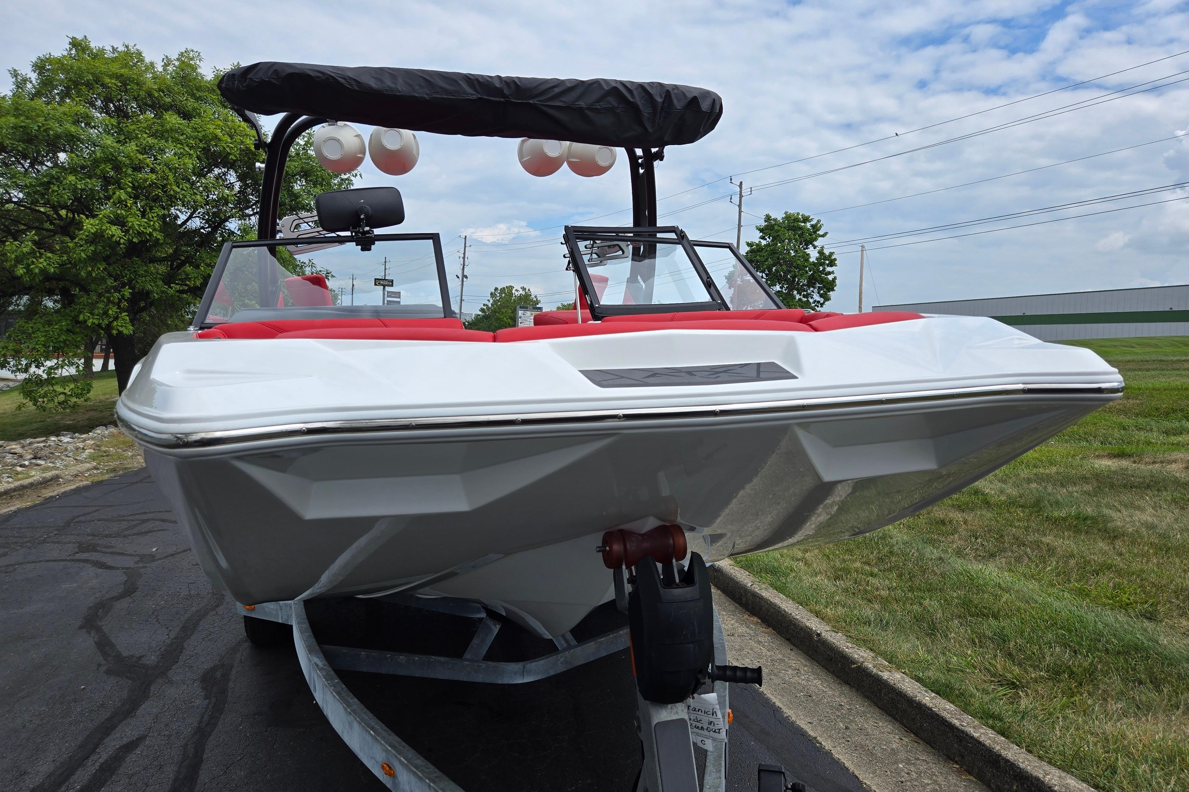 2022 ATX Surf Boats 20 Type-S on trailer, featuring sleek design and red interior accents.