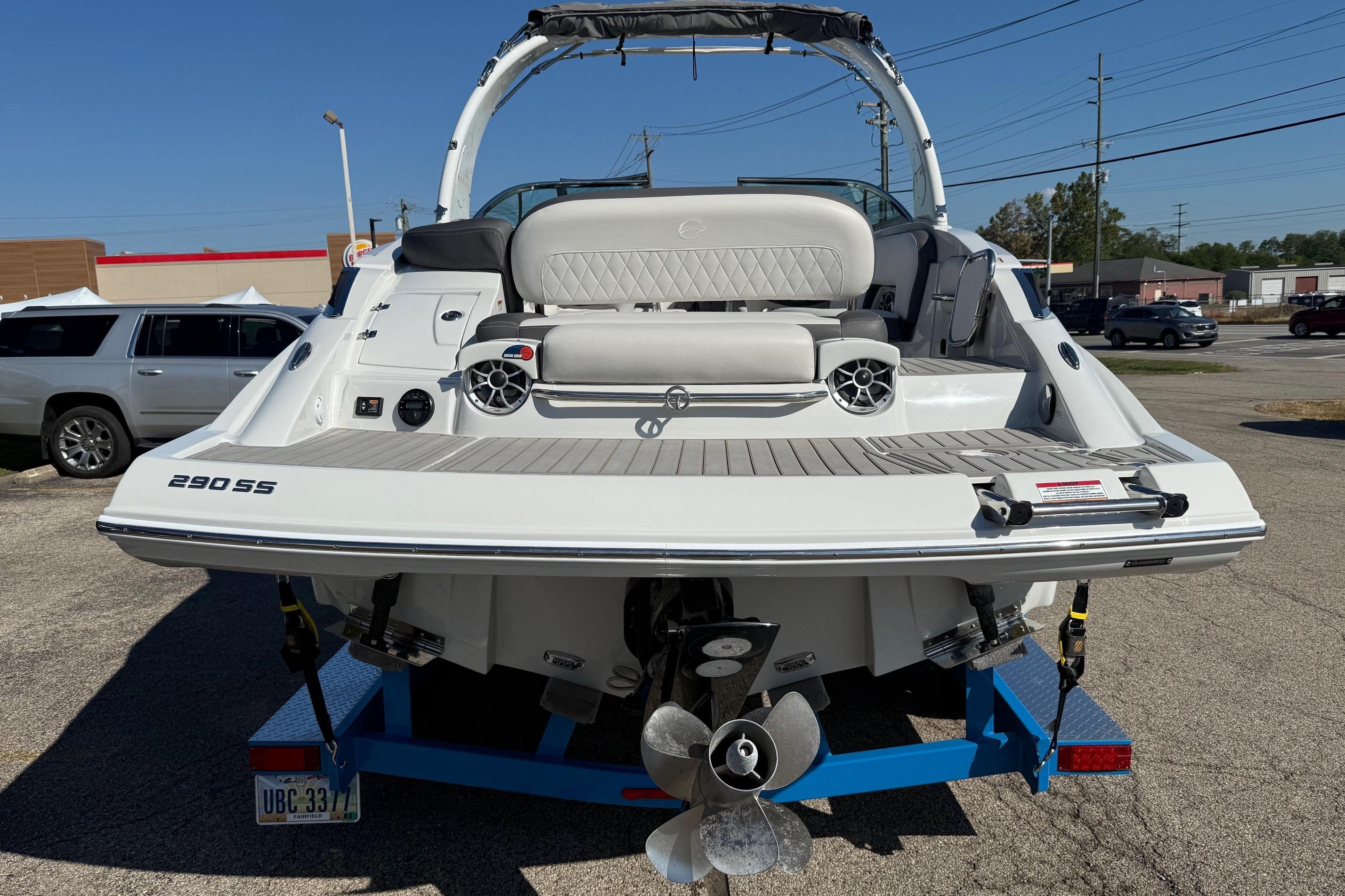 2023 Crownline 290 SS boat on trailer, rear view showing deck and seating.