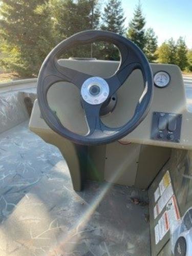 2024 Tracker Grizzly 1754 SC steering wheel and dashboard in a boat.