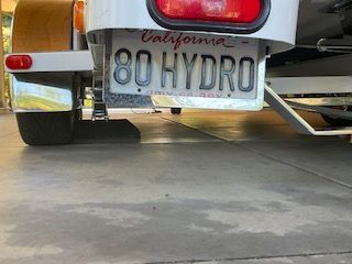 Close-up of a boat trailer with California license plate "80 HYDRO."