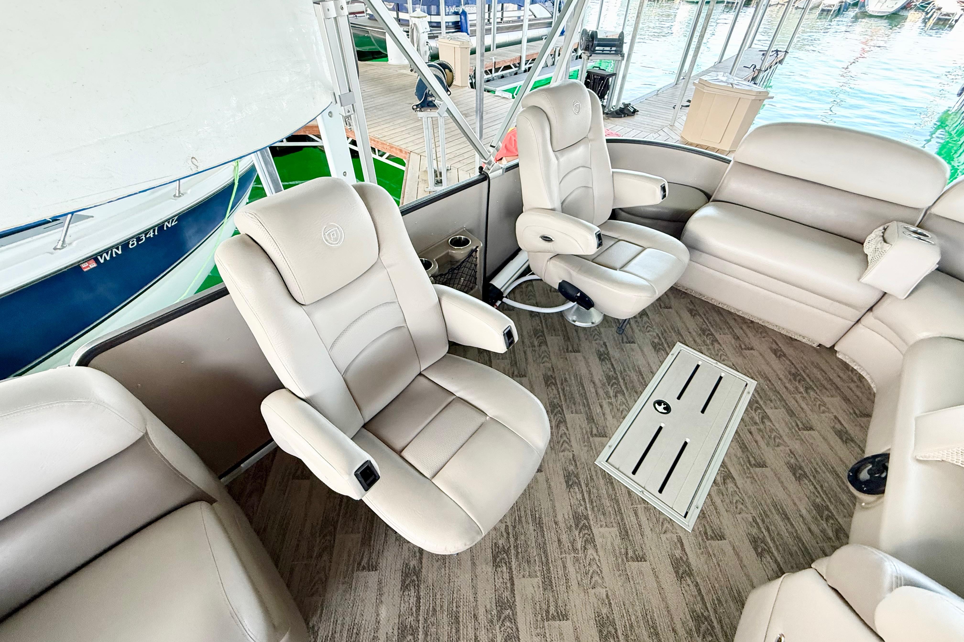 Luxurious interior of 2011 Premier 275 Grand Majestic PTX pontoon boat with plush seating.