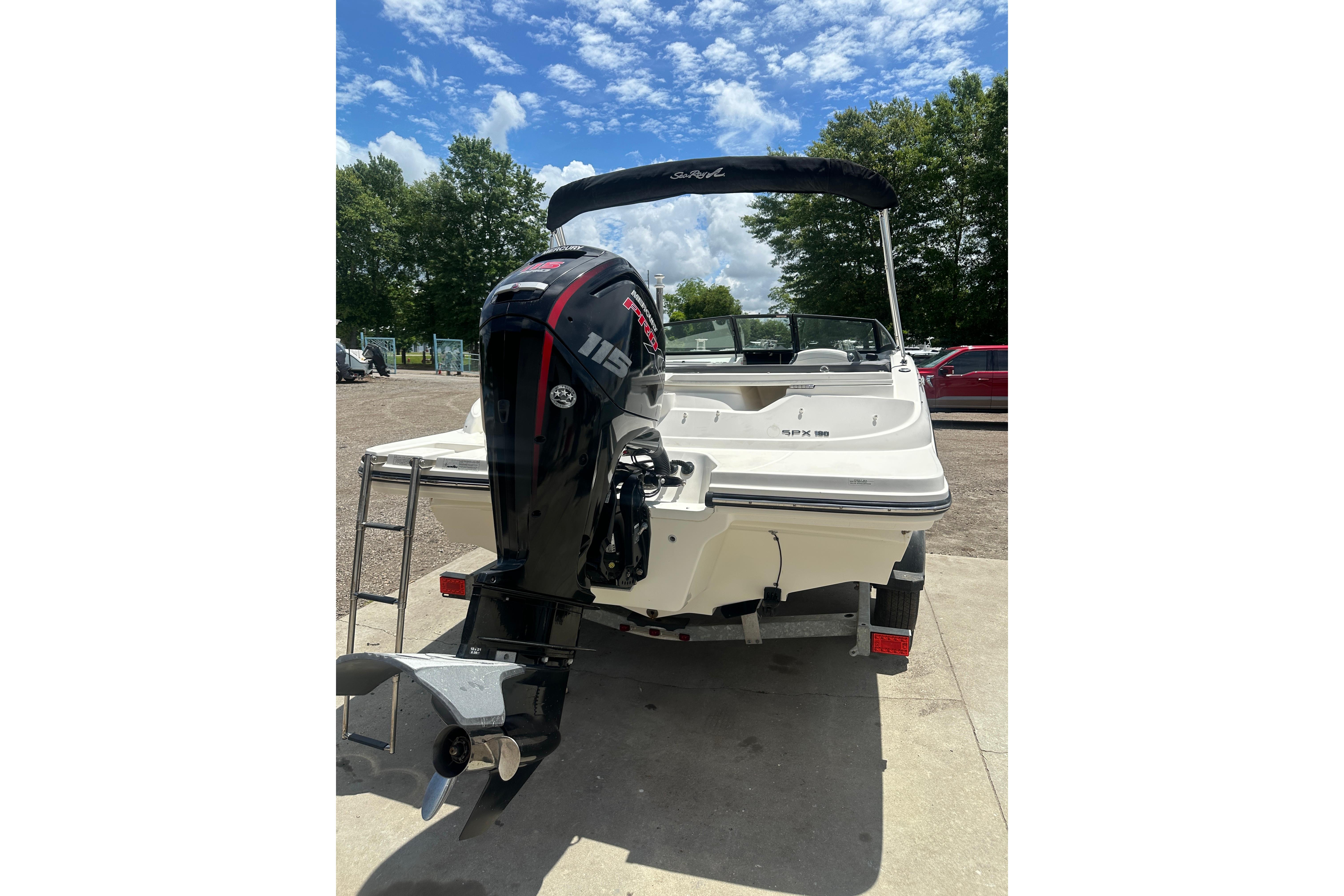 2017 Sea Ray SPX 190 Outboard boat with powerful engine, parked outdoors.