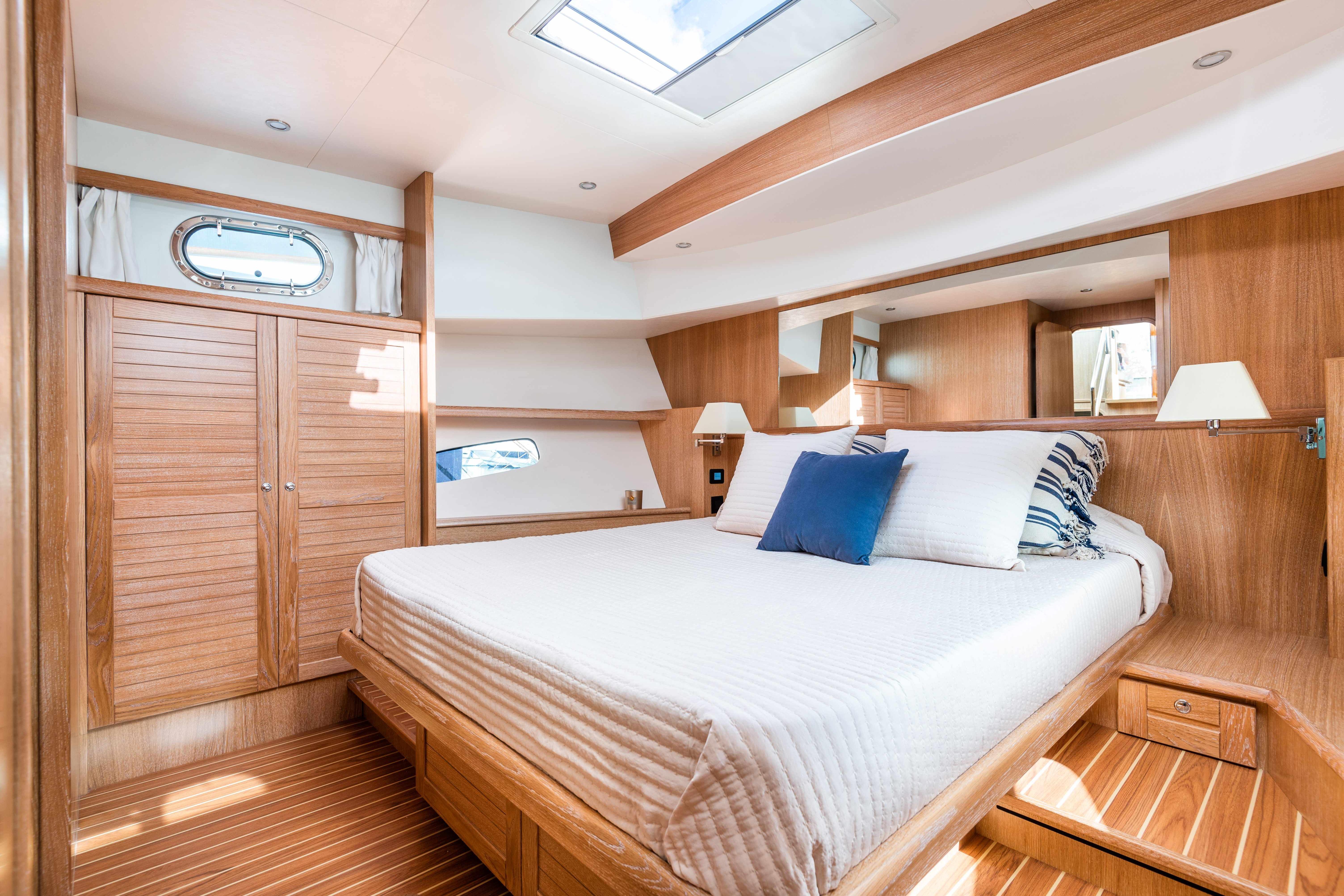 Luxurious cabin interior of 2026 Sasga Yachts Menorquin 55 HT with elegant wood finish.