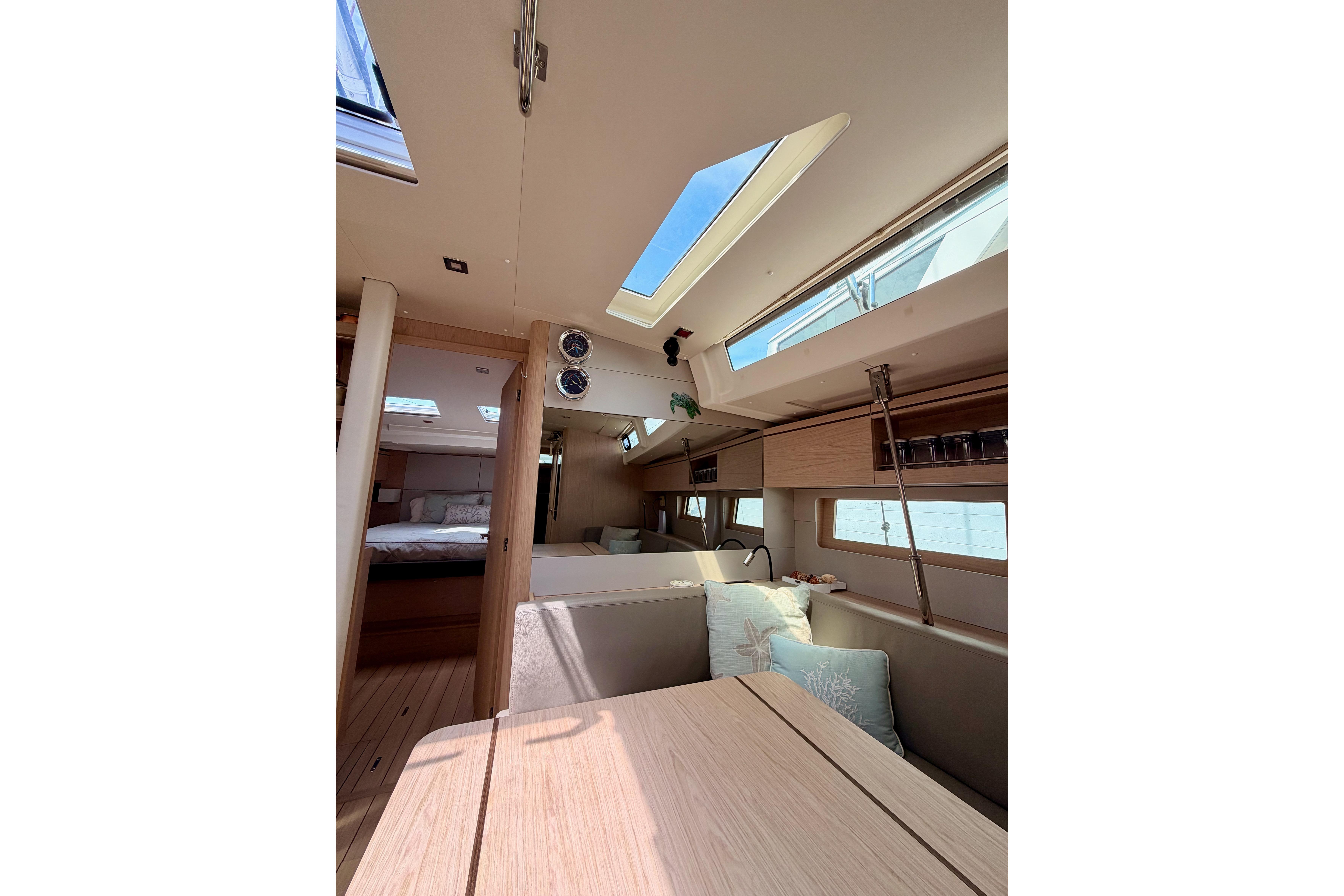 Interior of 2020 Beneteau Oceanis 51.1 yacht, featuring modern design and skylights.