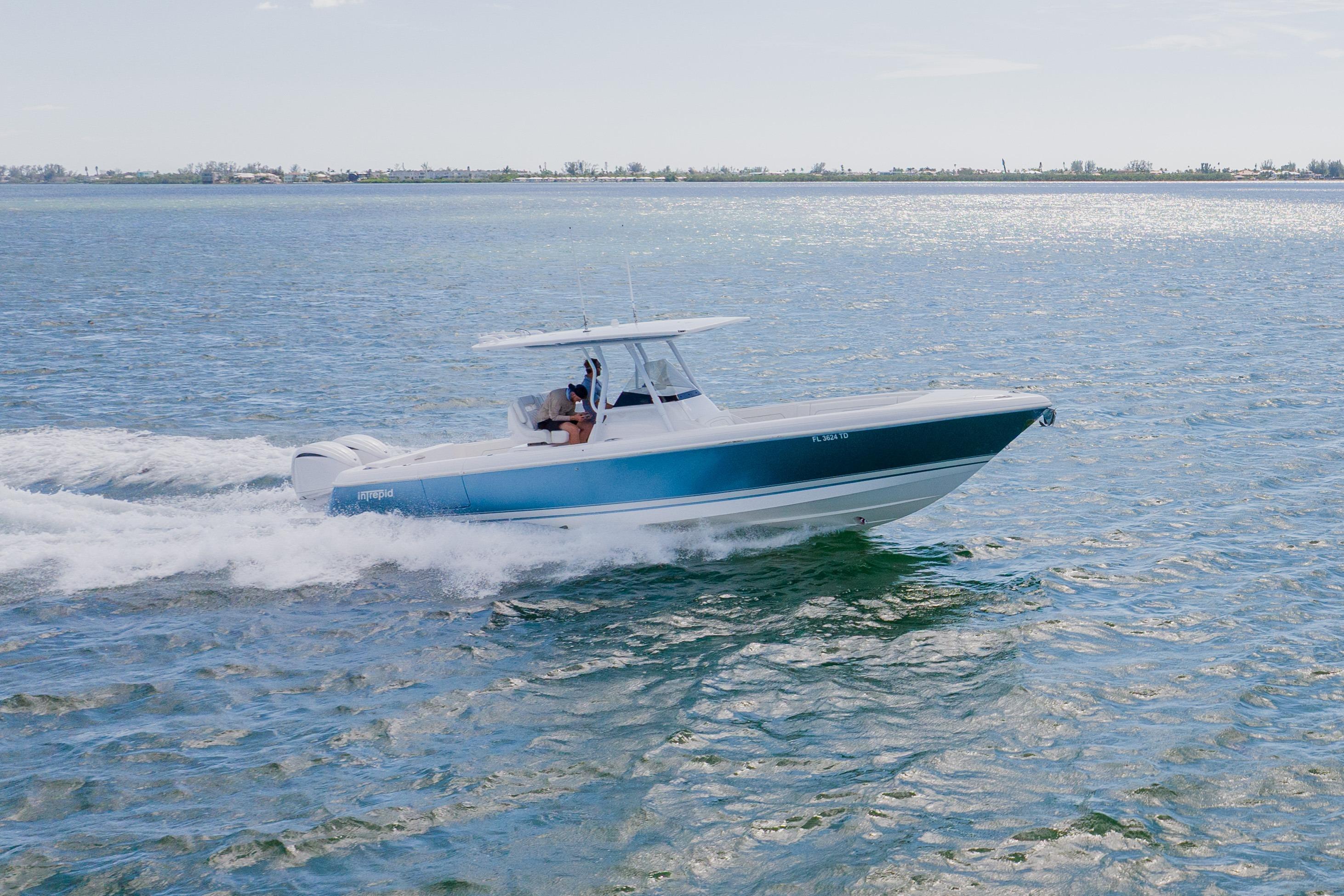 2018 Intrepid 327 Center Console boat cruising on open water.