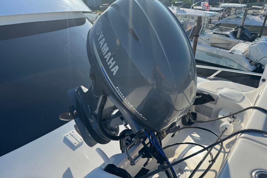 Yamaha outboard motor on 2002 Viking 61 Enclosed Bridge yacht, docked in marina.