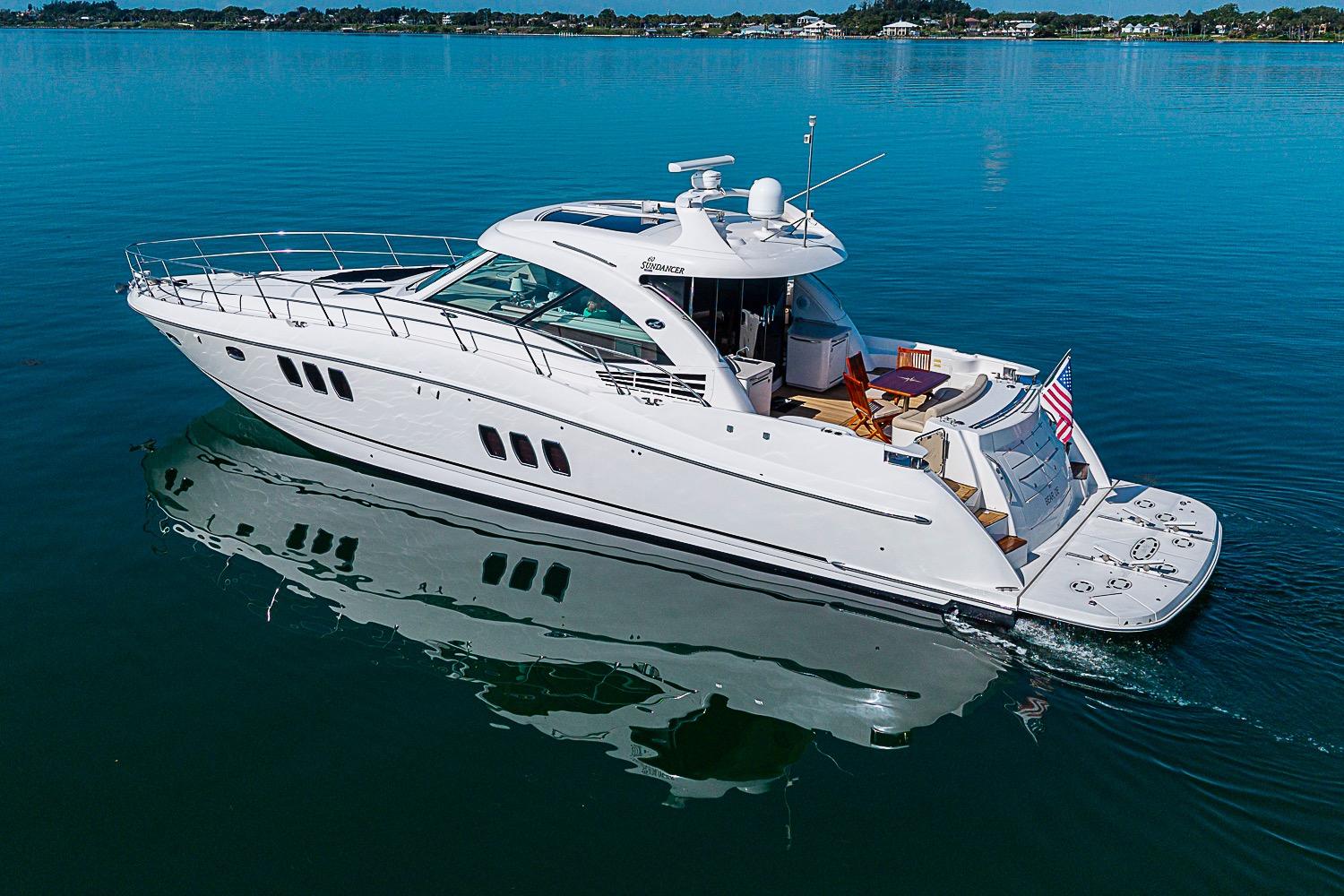 2008 Sea Ray 60 Sundancer yacht cruising on calm blue waters.