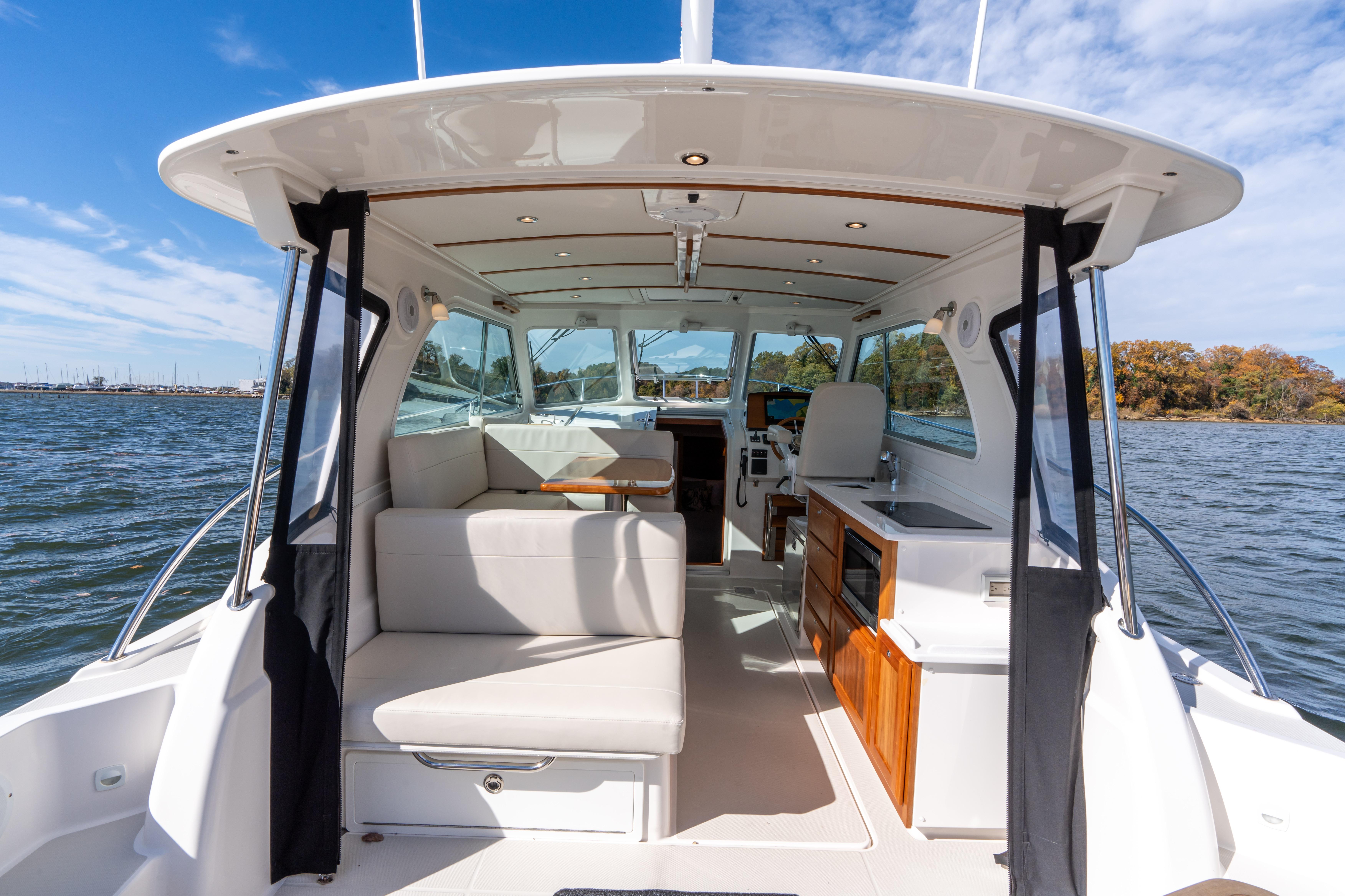 Aft facing bench seat lifts and folds to face the dinette when needed.