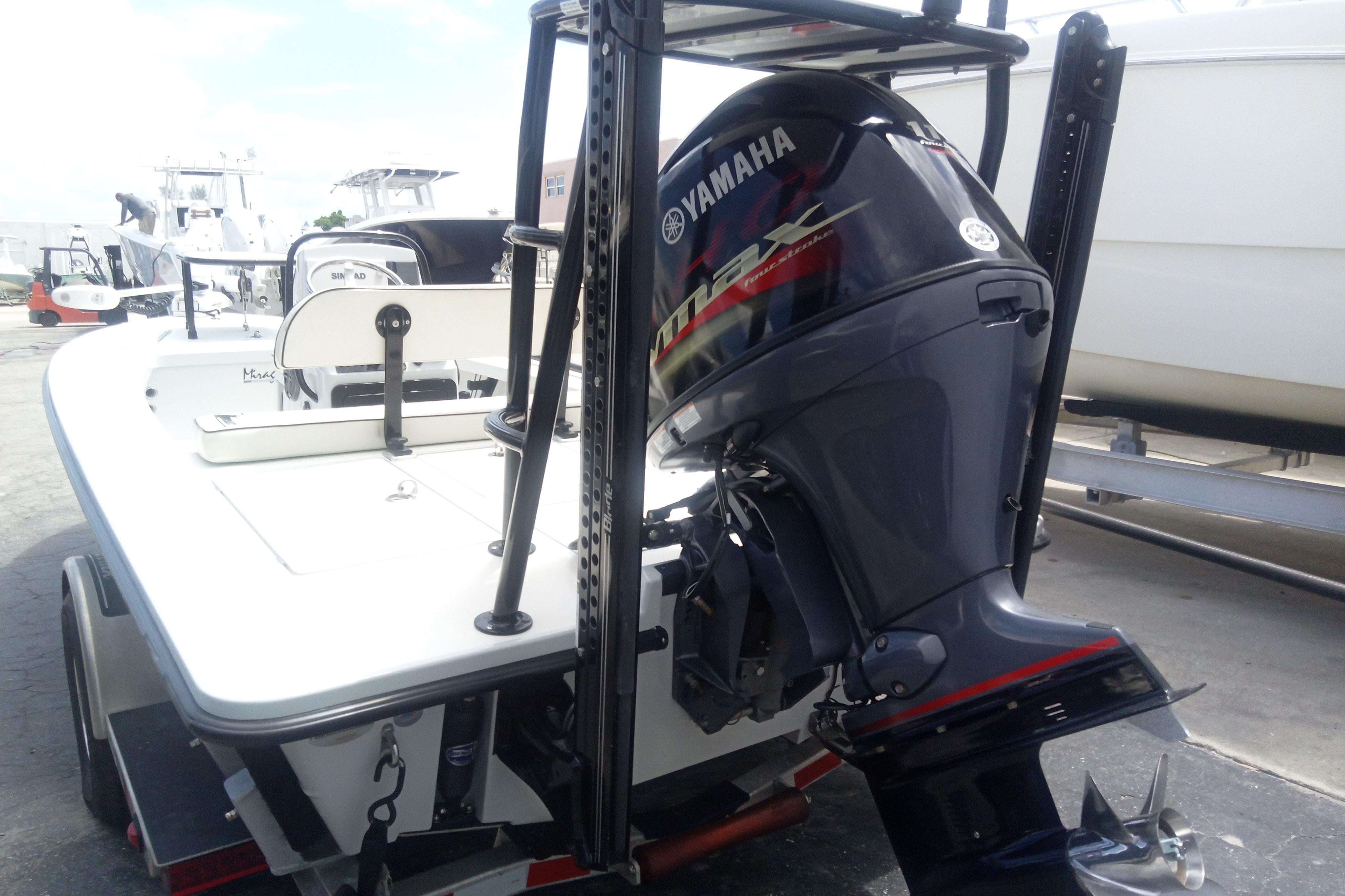 2020 Maverick 18 HPX-V boat with Yamaha outboard motor, docked on a trailer.