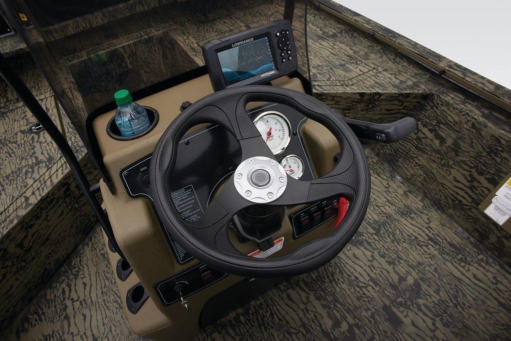 Steering console of 2026 Tracker GRIZZLY® 2072 CC Sportsman boat with gauges and navigation system.