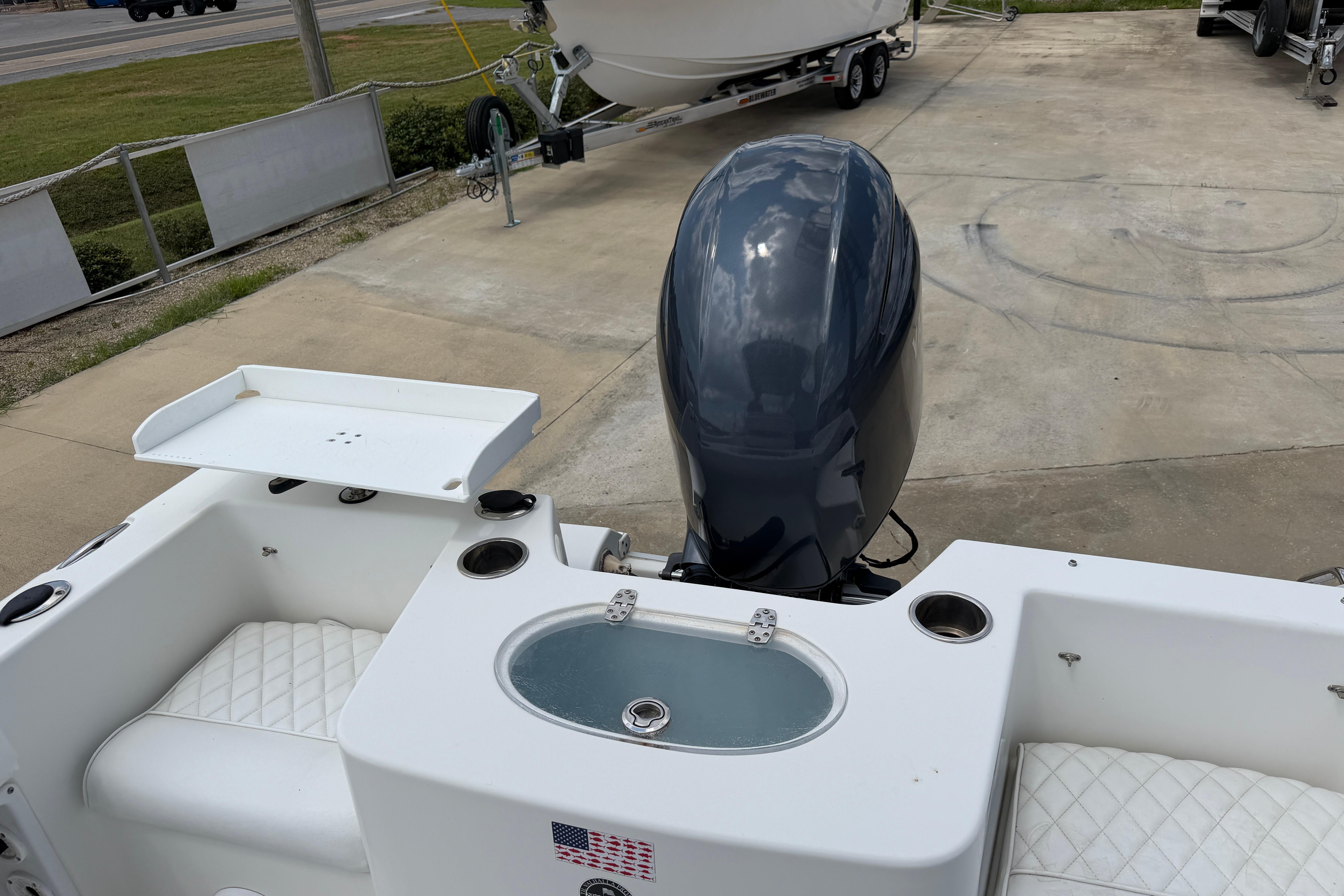 2015 Sea Hunt Triton 225 boat with outboard motor and seating area.