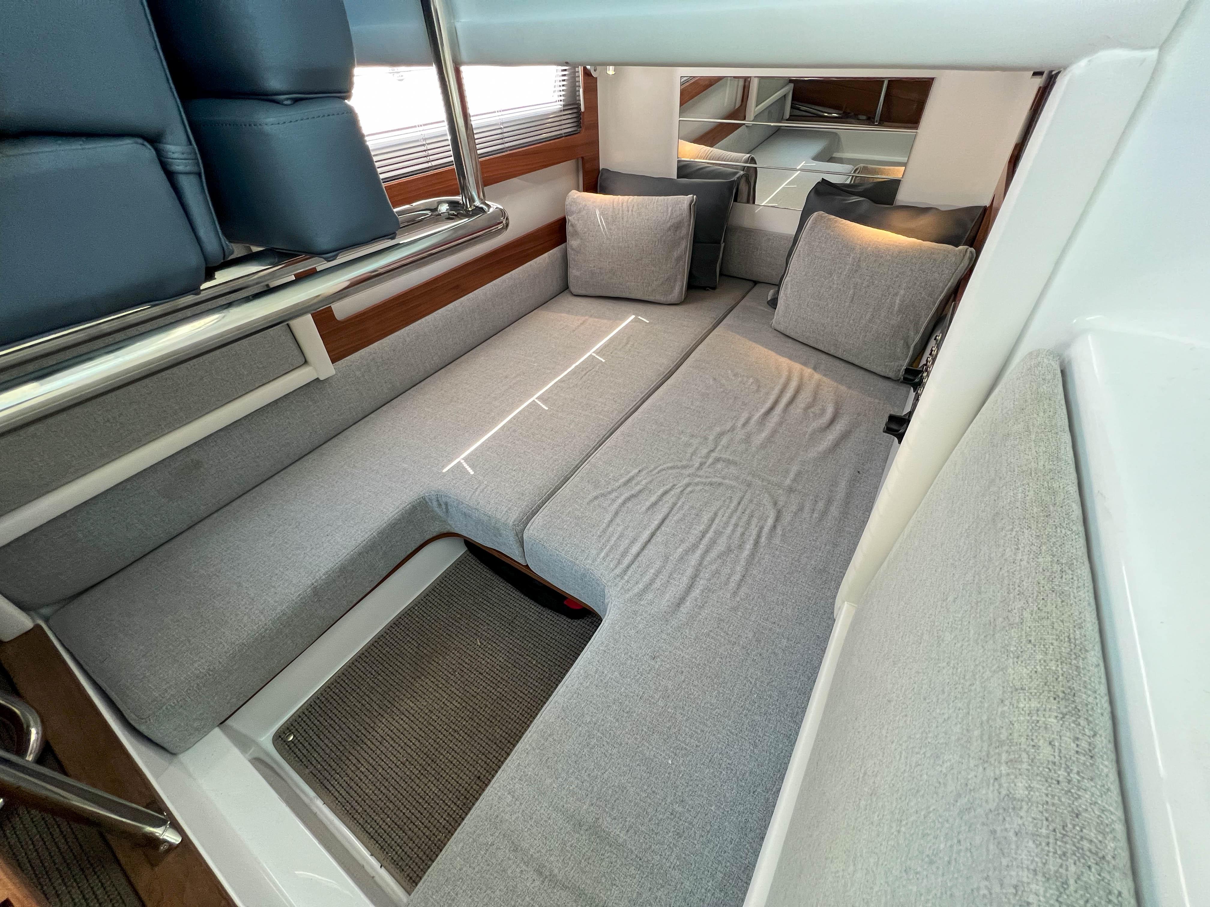 Interior of 2020 Axopar 28 Cabin with gray upholstery.
