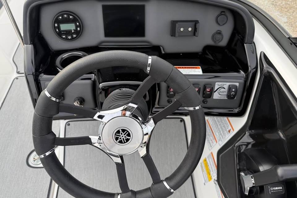2026 Yamaha Boats SX195 steering wheel and dashboard controls.