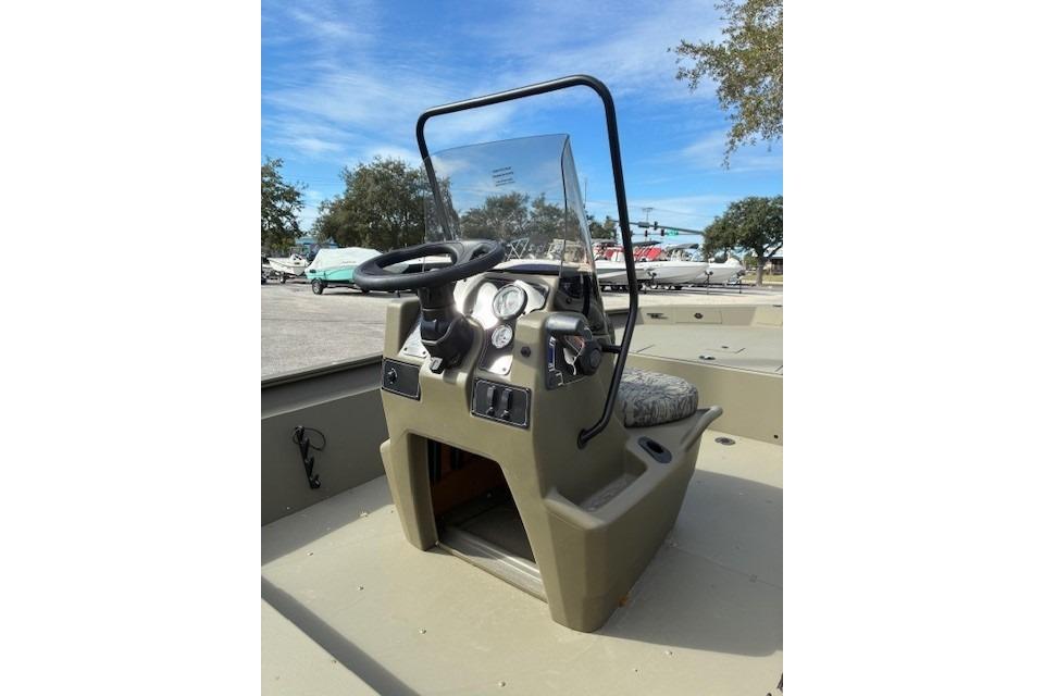 2026 Tracker Grizzly 1860 CC boat console with steering wheel and gauges.