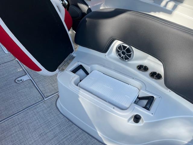 2024 Crownline 290 SS boat interior with built-in cooler and speaker.