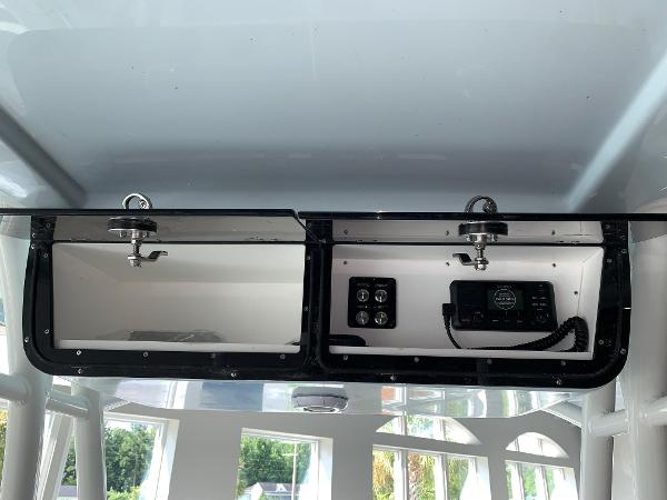 2024 Key West 263 FS boat console storage with electronic controls.