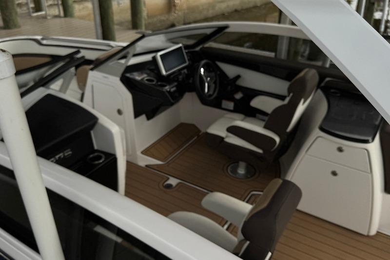 2023 Yamaha 275SDX boat interior with modern dashboard and seating.