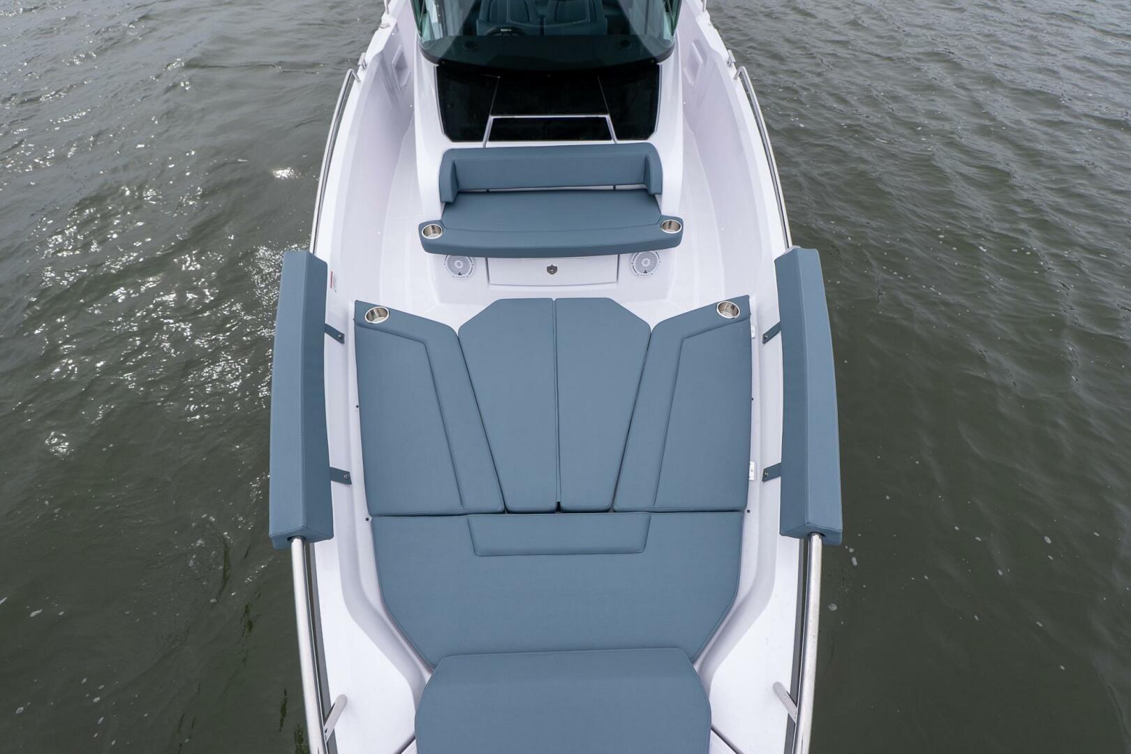 2026 Axopar 29 XC Cross Cabin boat with sleek seating on calm water.