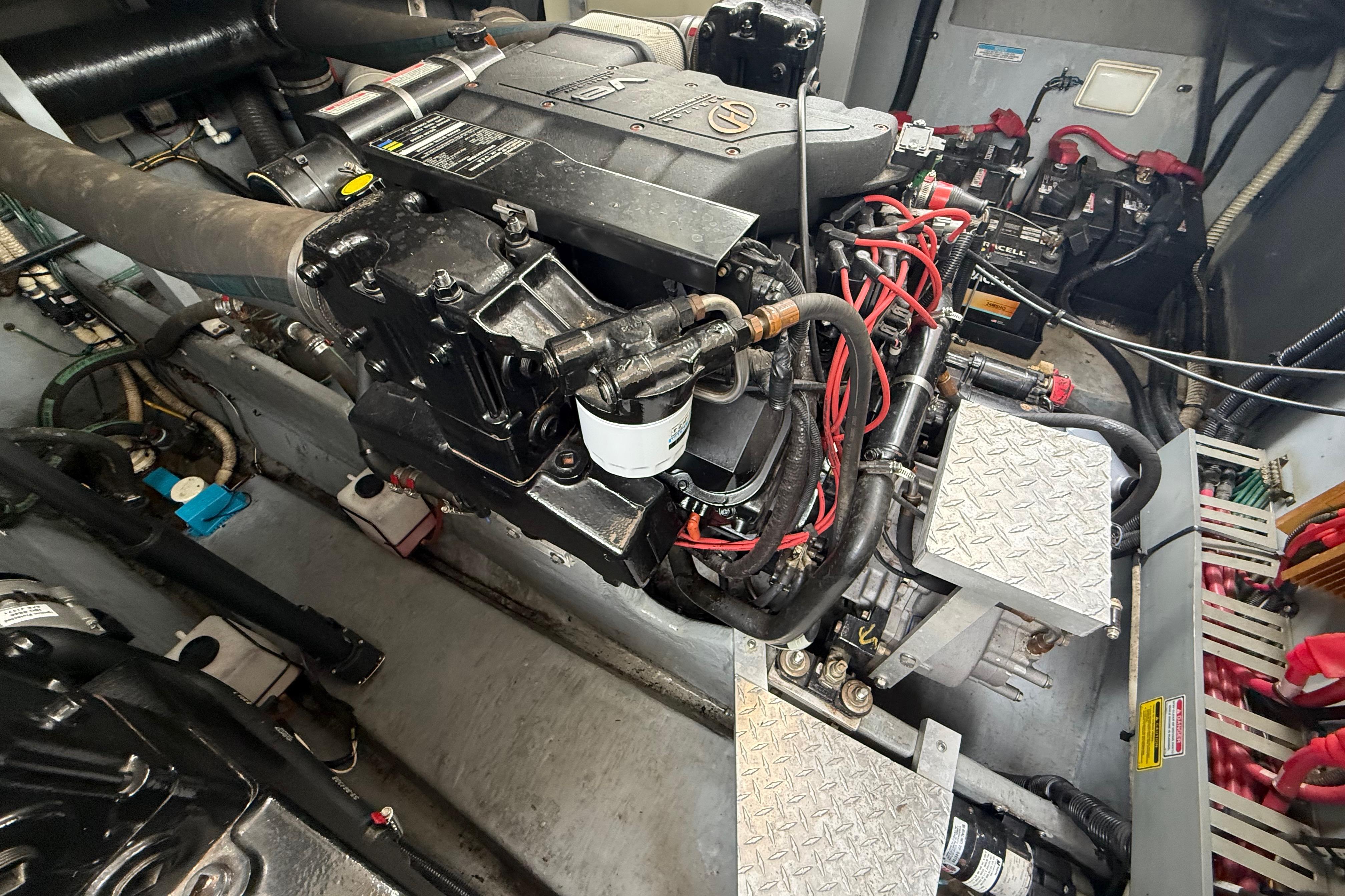 Engine room of a 1998 Sea Ray Sundancer 400 with visible machinery and components.