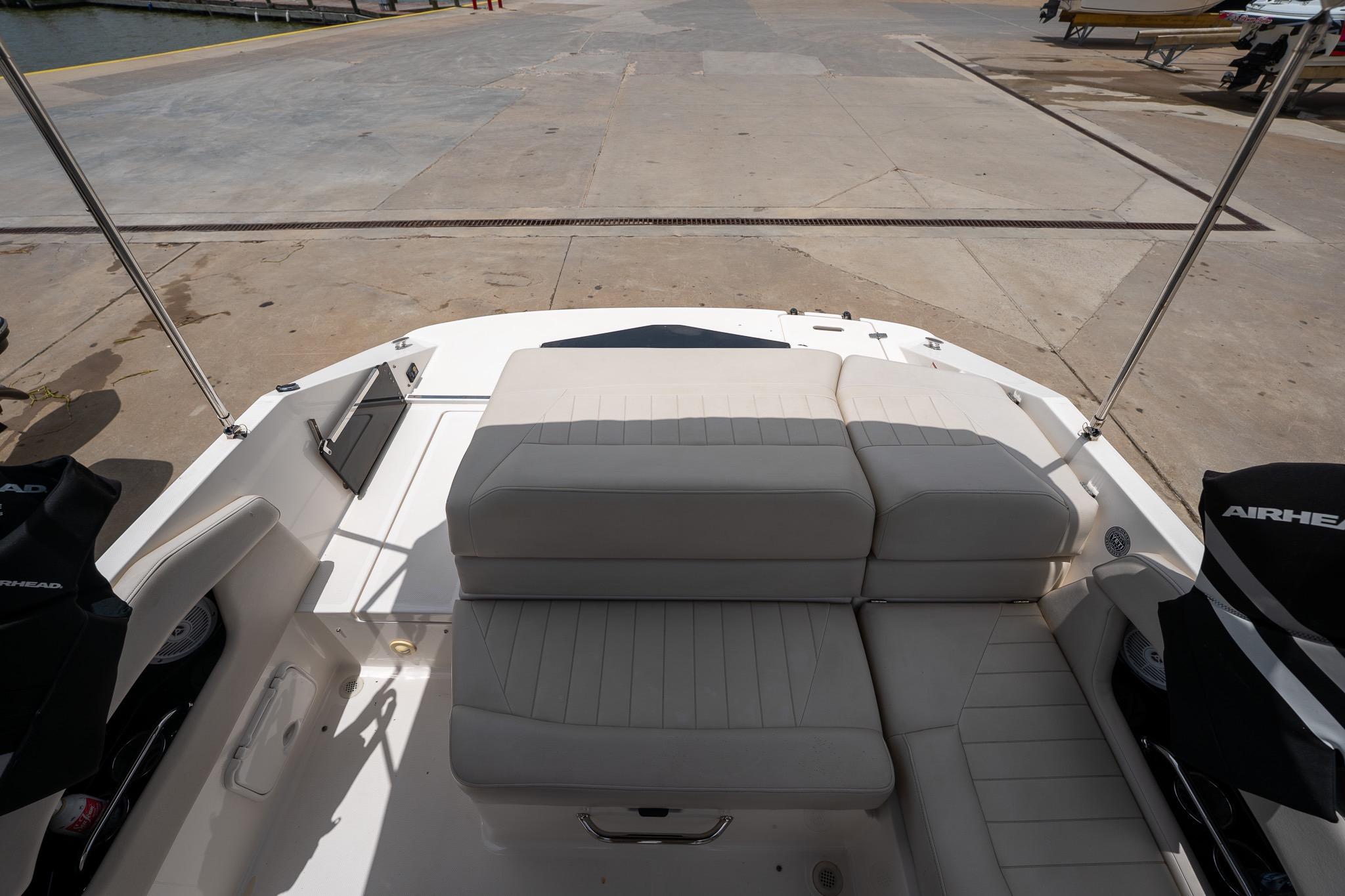 2008 Regal 2000 Bowrider boat interior with beige seating at a dock.