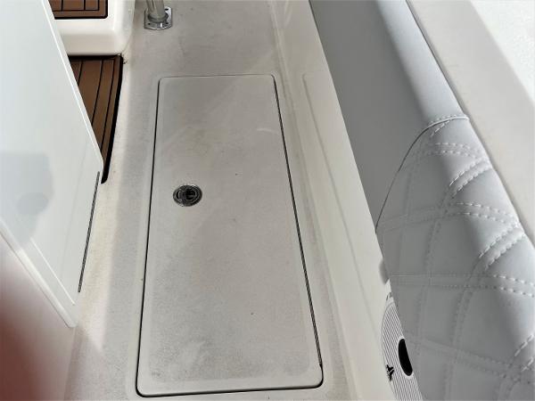 2020 Front Runner 39 Center Console boat deck with storage compartment and cushioned seating.