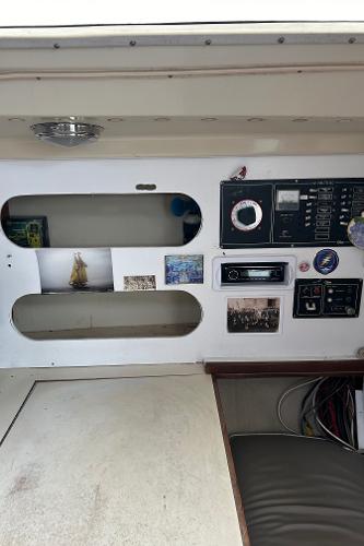 Interior control panel of a 1983 O'Day 39 sailboat with various gauges and decor.