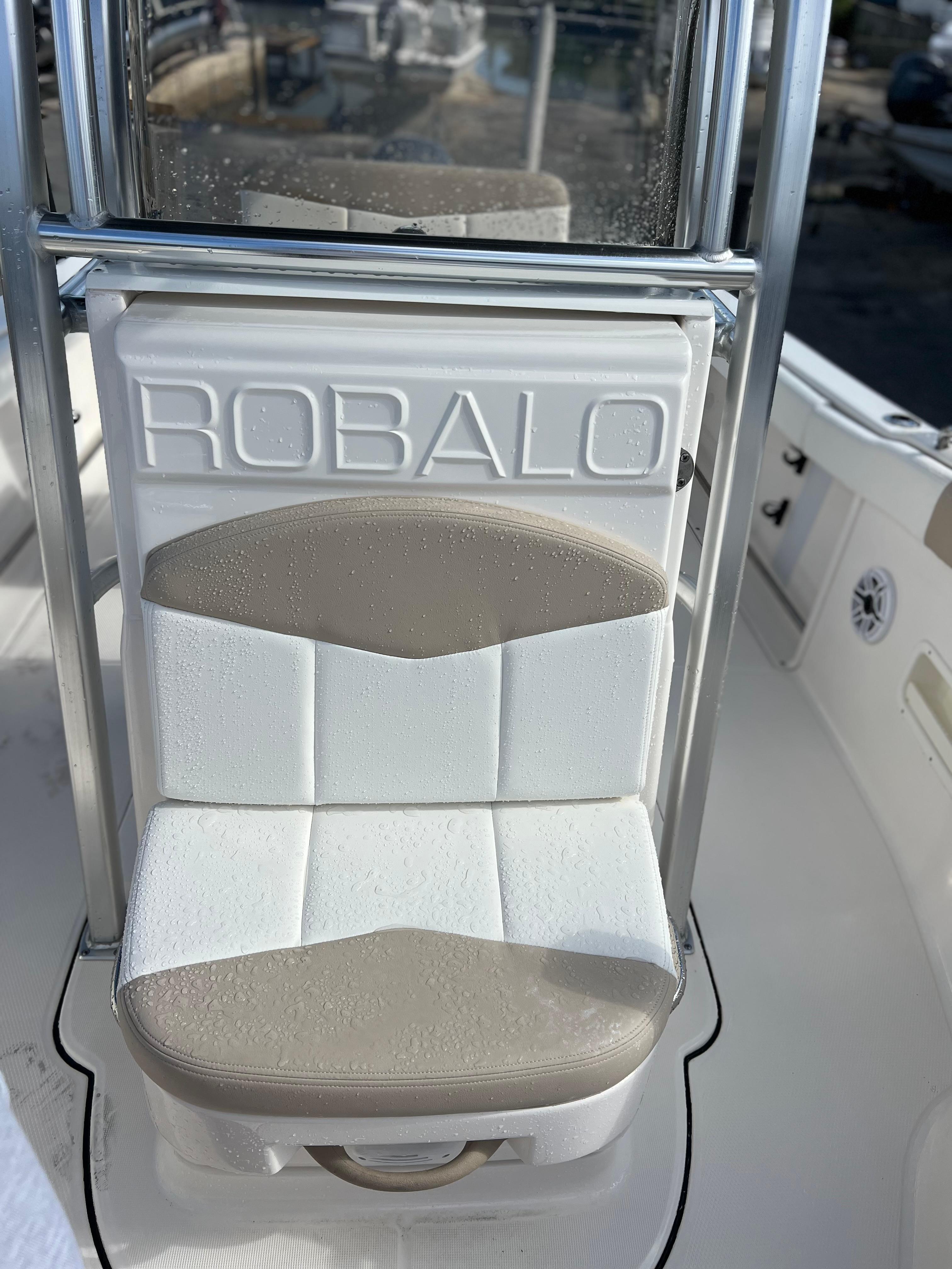 2022 Robalo R222 Center Console boat seat with logo, featuring white and beige upholstery.