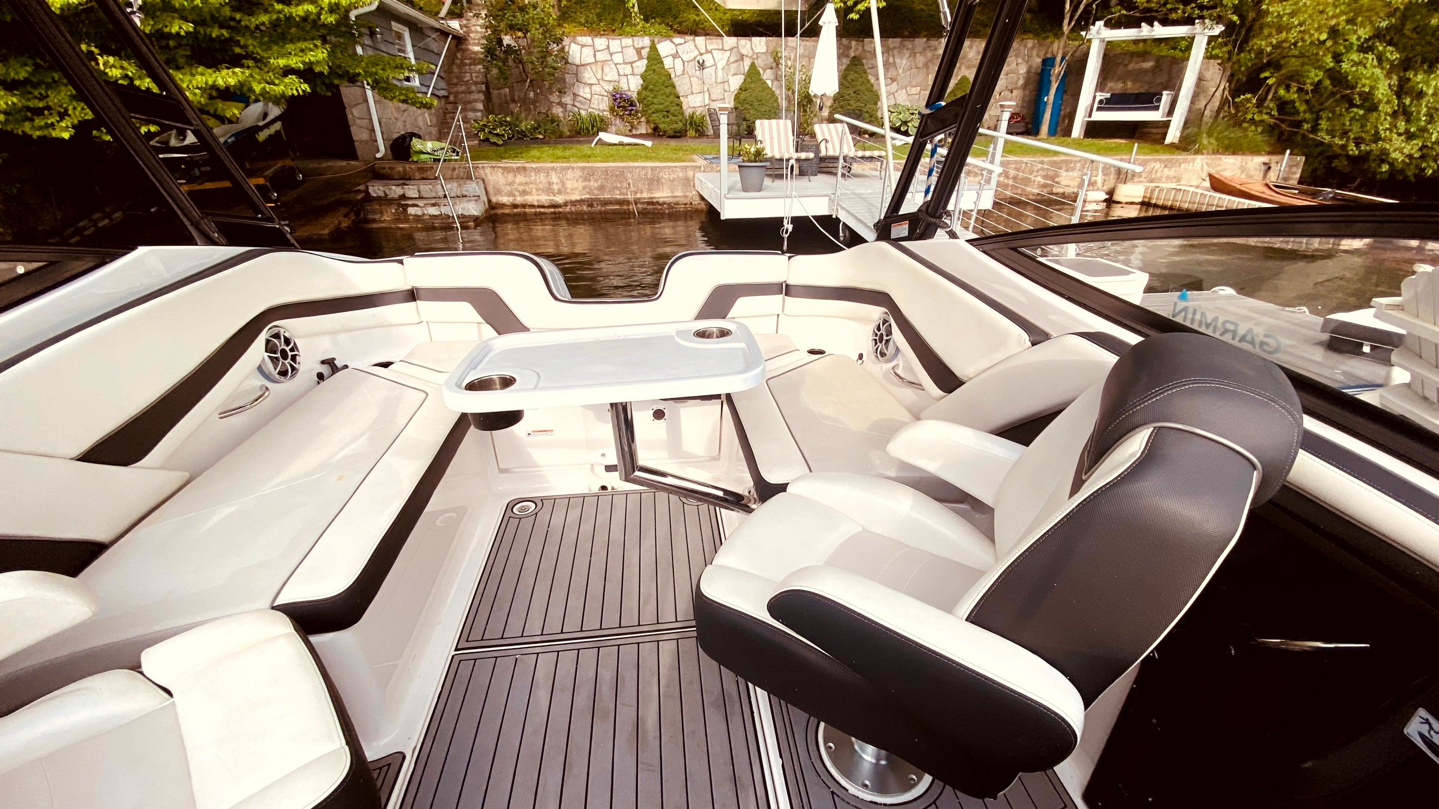 Interior of a 2016 Yamaha AR240 boat with luxurious seating.