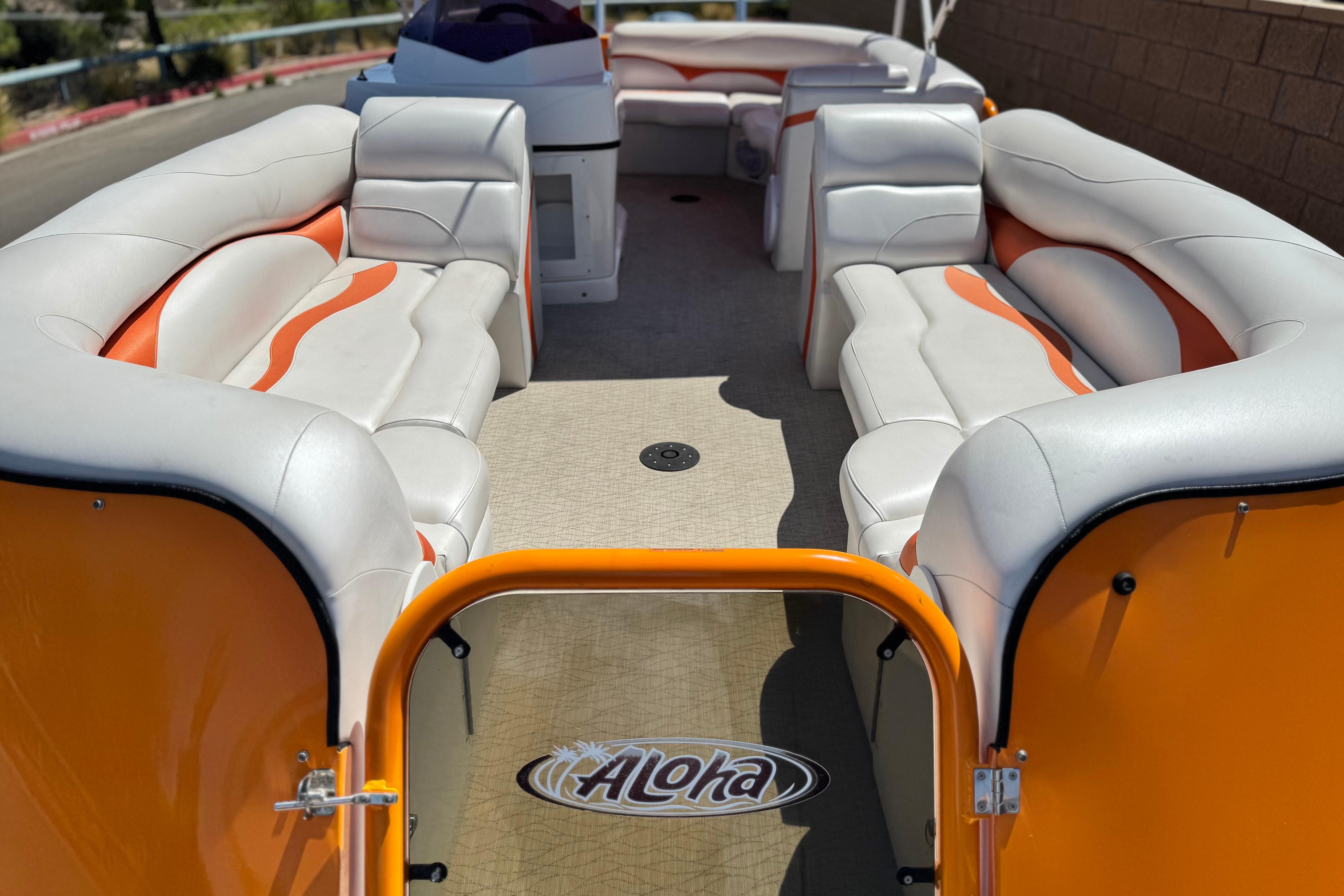 2022 Aloha Pontoon 230 with spacious seating and vibrant orange accents.