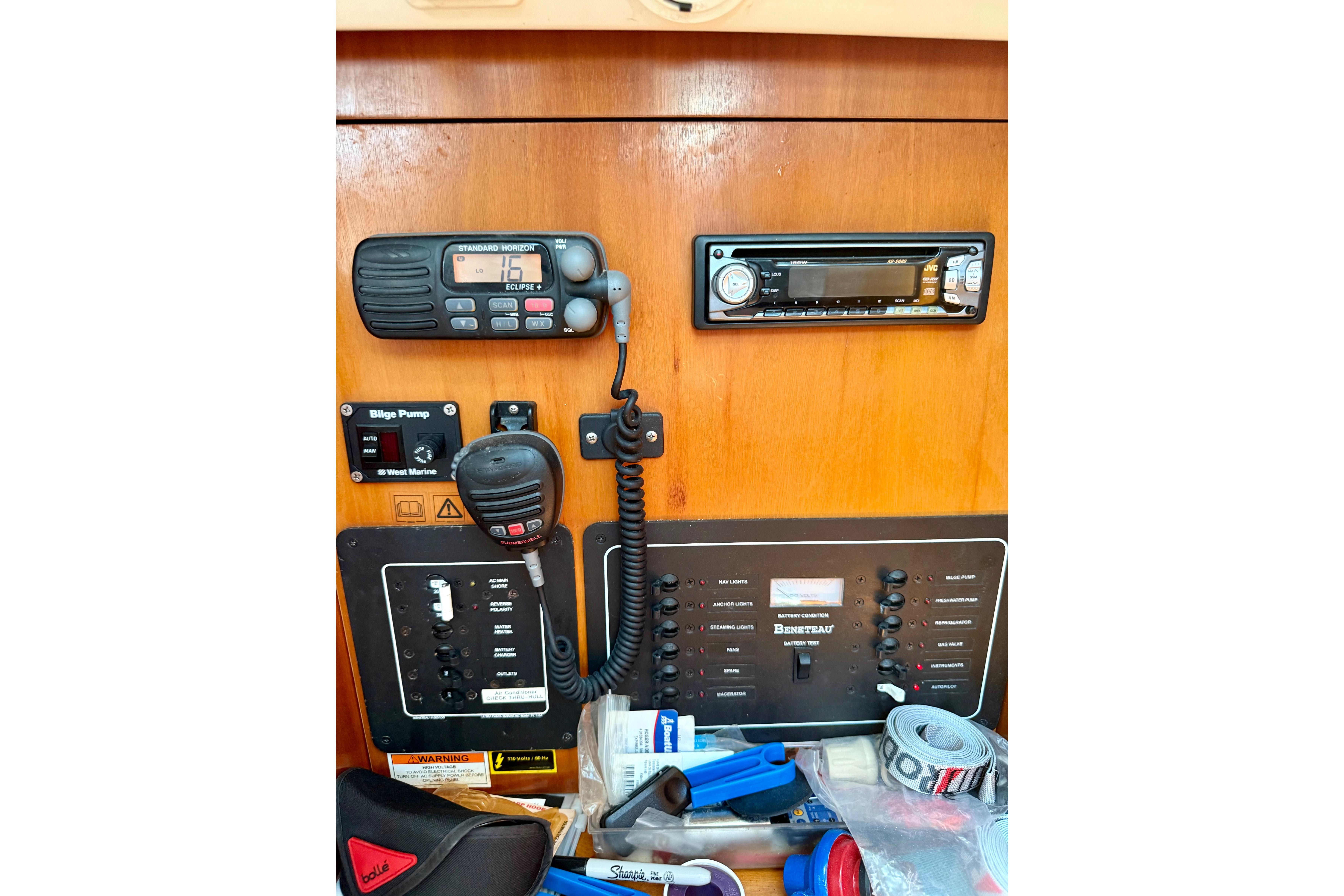 Control panel of a 2002 Beneteau Oceanis Clipper 311 sailboat with radio and equipment.