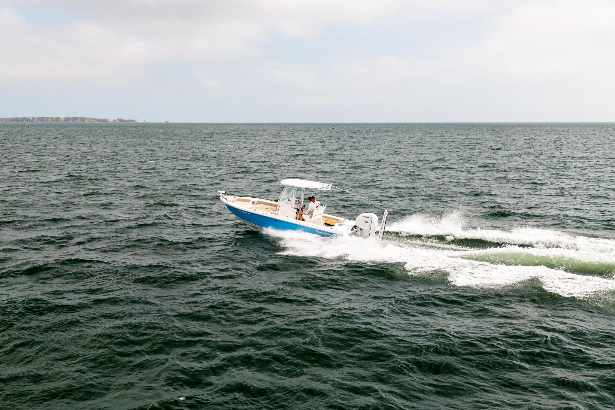 2023 Everglades 243 Center Console boat cruising on open water.