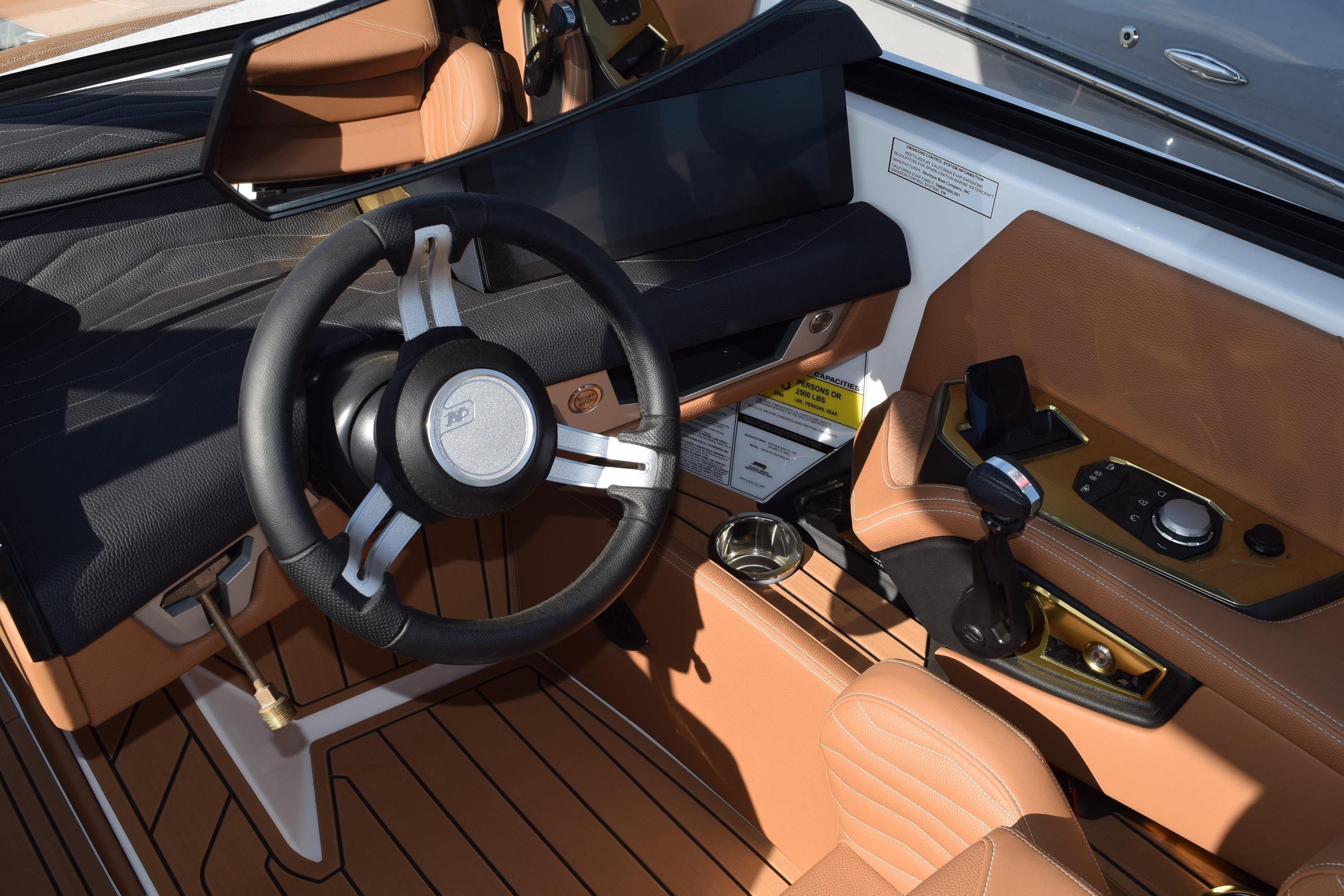 2026 Nautique Super Air Nautique G23 cockpit with sleek steering wheel and modern controls.