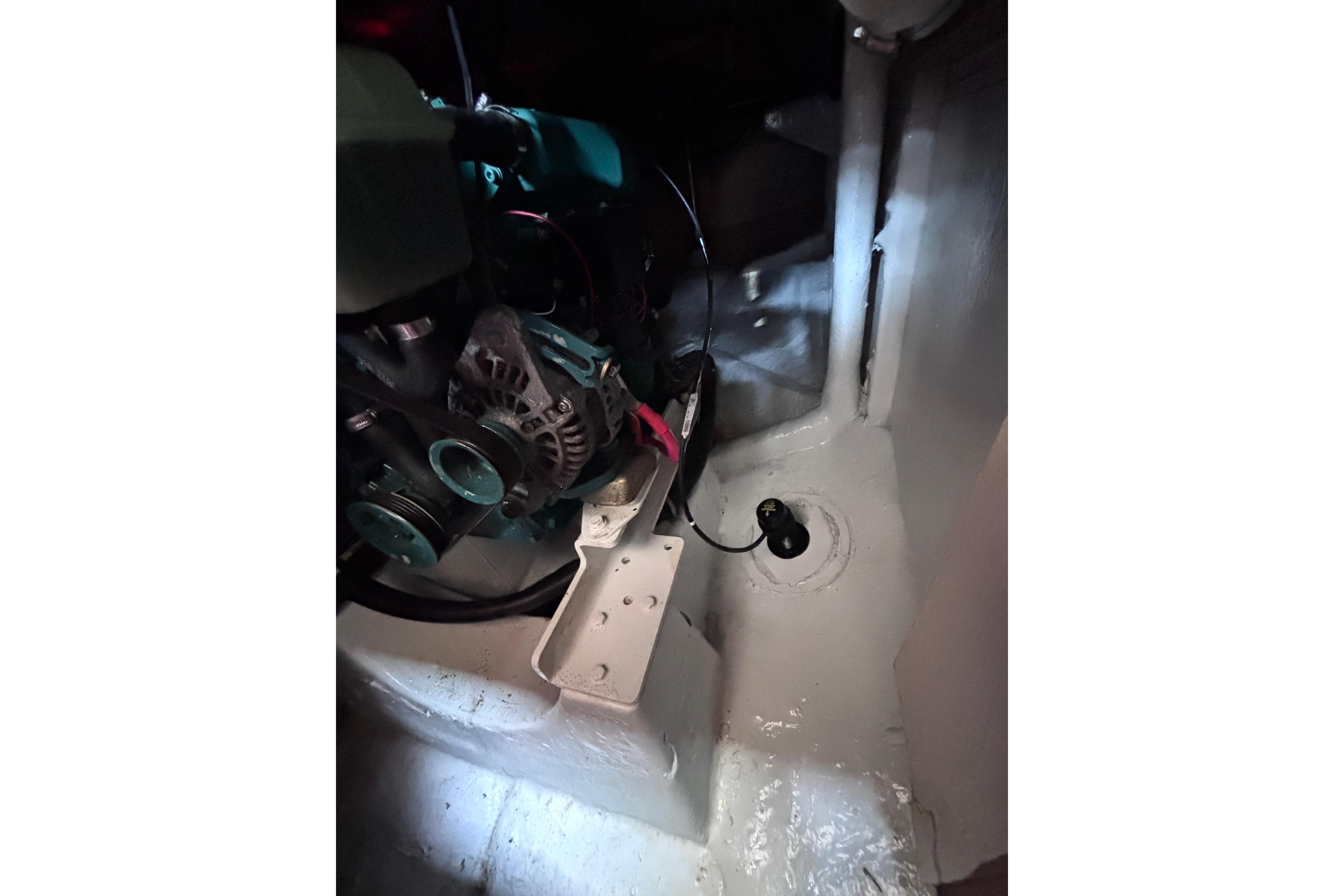 Engine compartment of a 1978 Swift 33 boat, featuring mechanical components and wiring.
